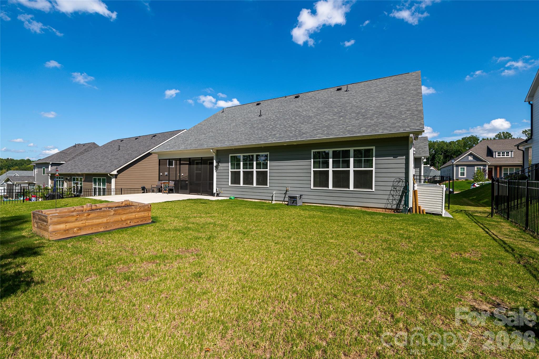 Spacious back yard with a raised garden bed. - 2566 NW Red Hill Street, Concord