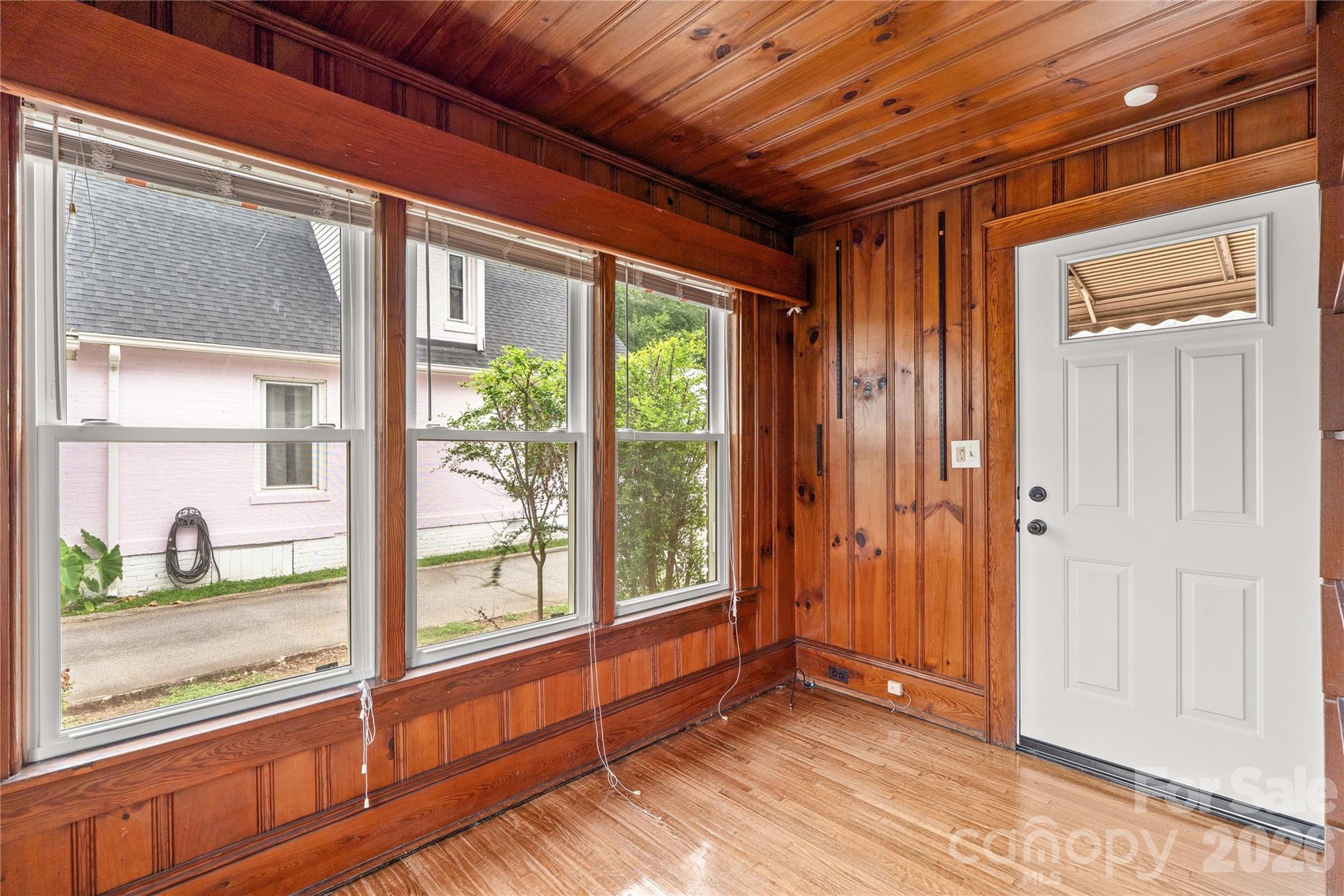 Main floor entry in back of house could be a perfect at-home business entry. Also could be a study or reading room. Paneling and shelving. - 615 S Church Street, Salisbury