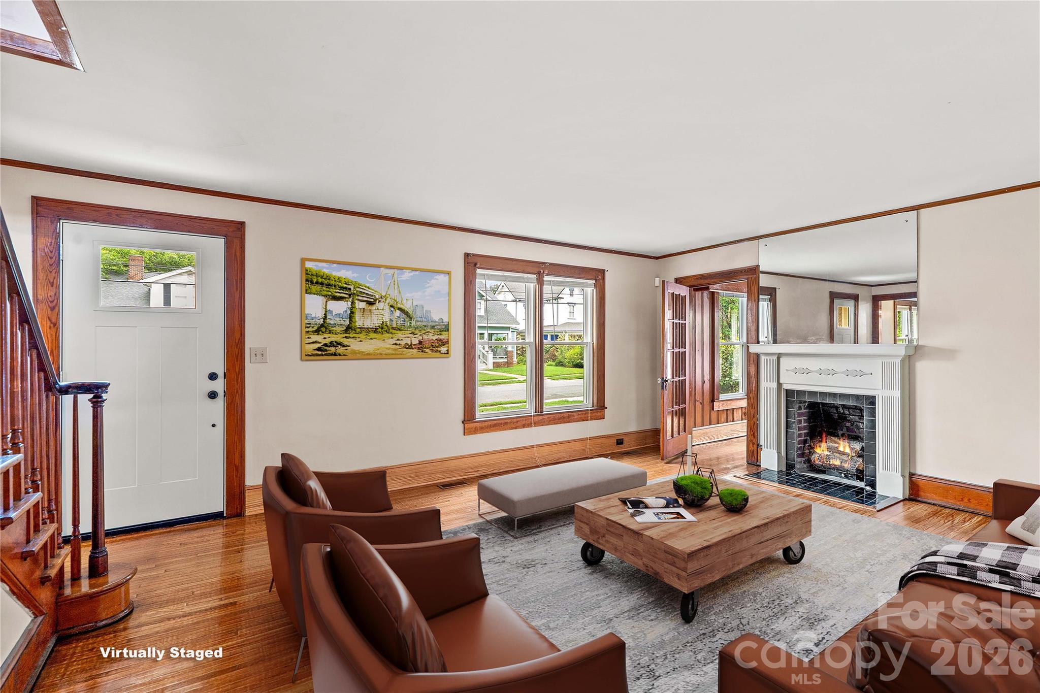 Living room with fireplace and front door. Study and separate entrance beyond the fireplace. - 615 S Church Street, Salisbury