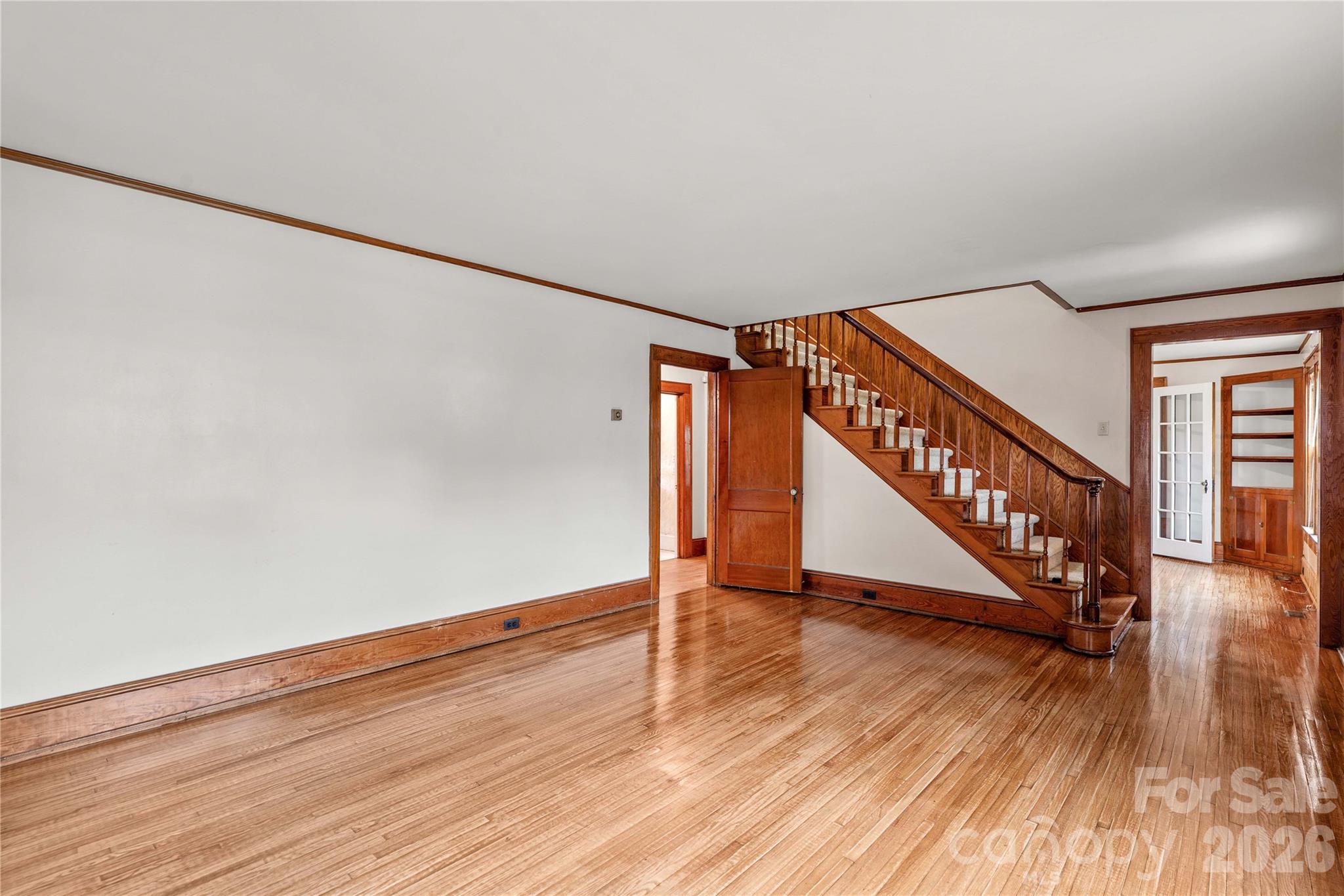 Living room is ready for your personal artwork, furniture and rugs. - 615 S Church Street, Salisbury
