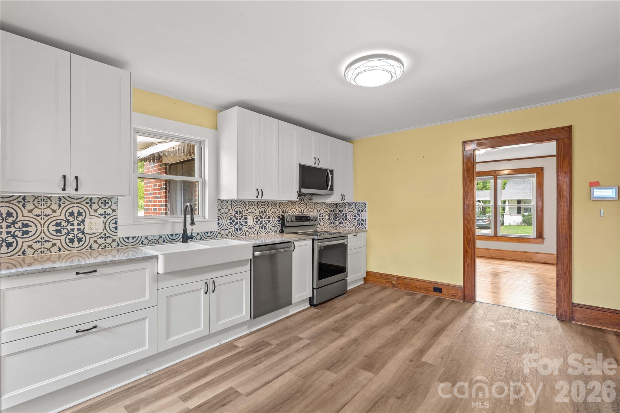 Kitchen on the back of the house has been updated and attached to the dining room. Walk in pantry to the left. - 615 S Church Street, Salisbury