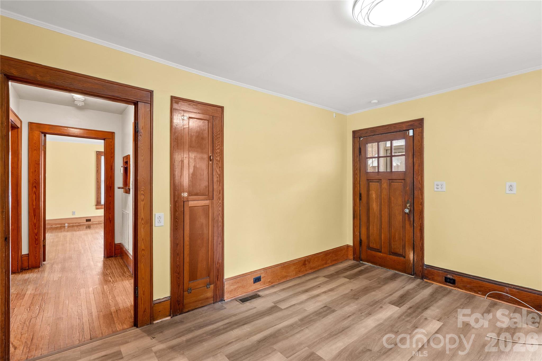 One of the 3 back doors enters into the kitchen. hallway to main floor bedroom. - 615 S Church Street, Salisbury