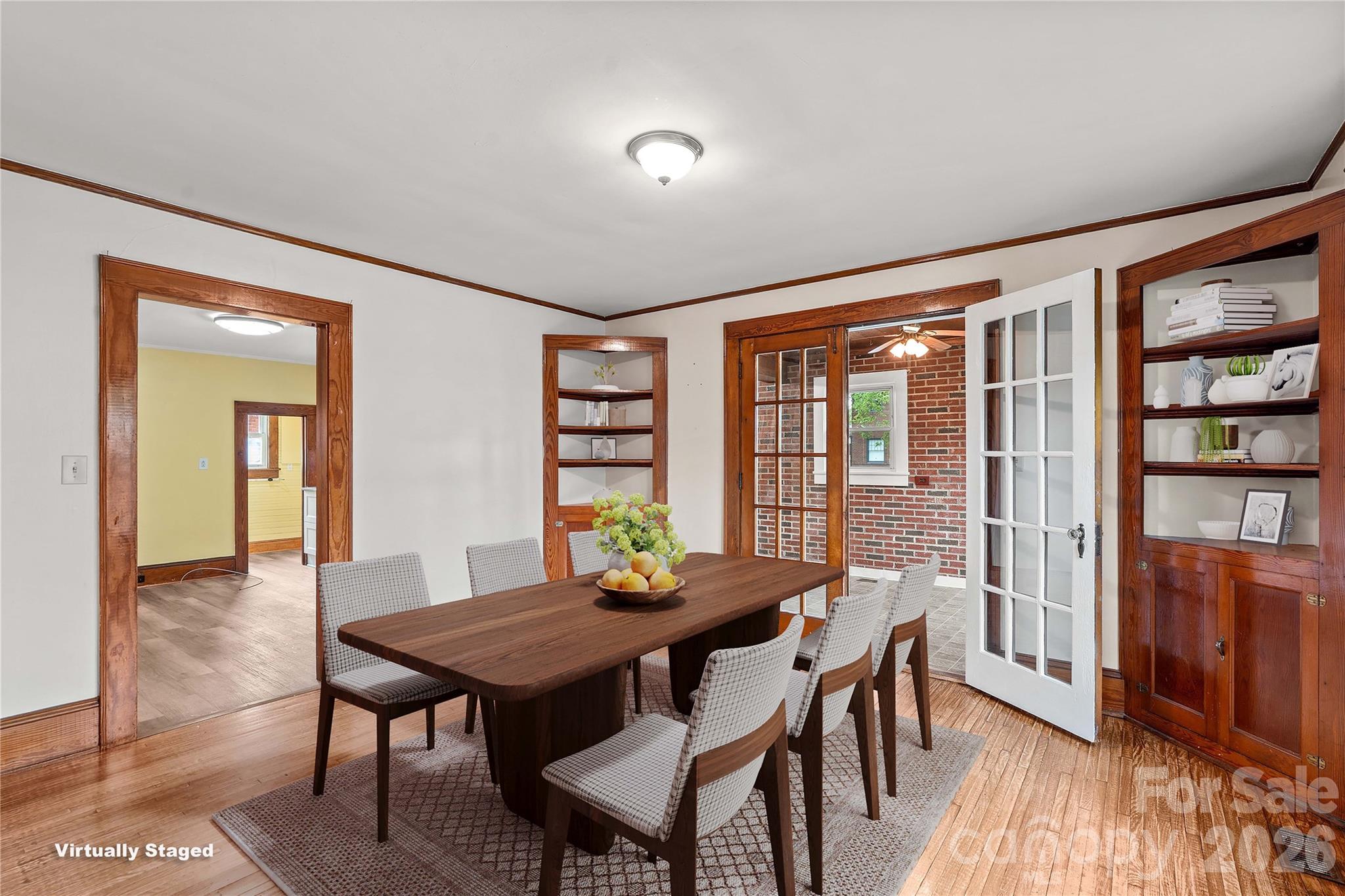 Dining room has corner cabinet and adjoins the kitchen and sunroom. - 615 S Church Street, Salisbury