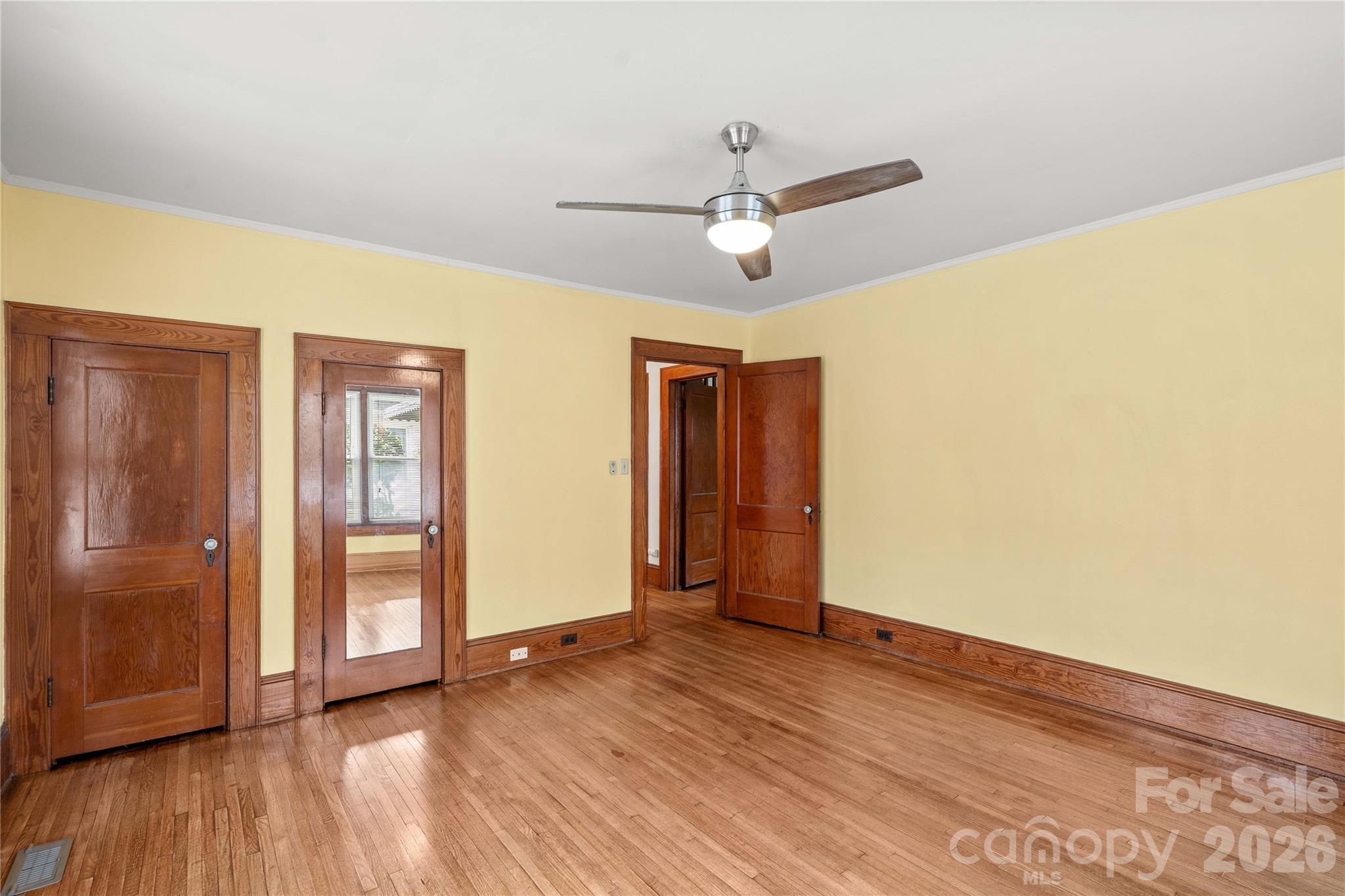 Main floor bedroom. Hardwoods and original hardware. New fan/light fixture. - 615 S Church Street, Salisbury