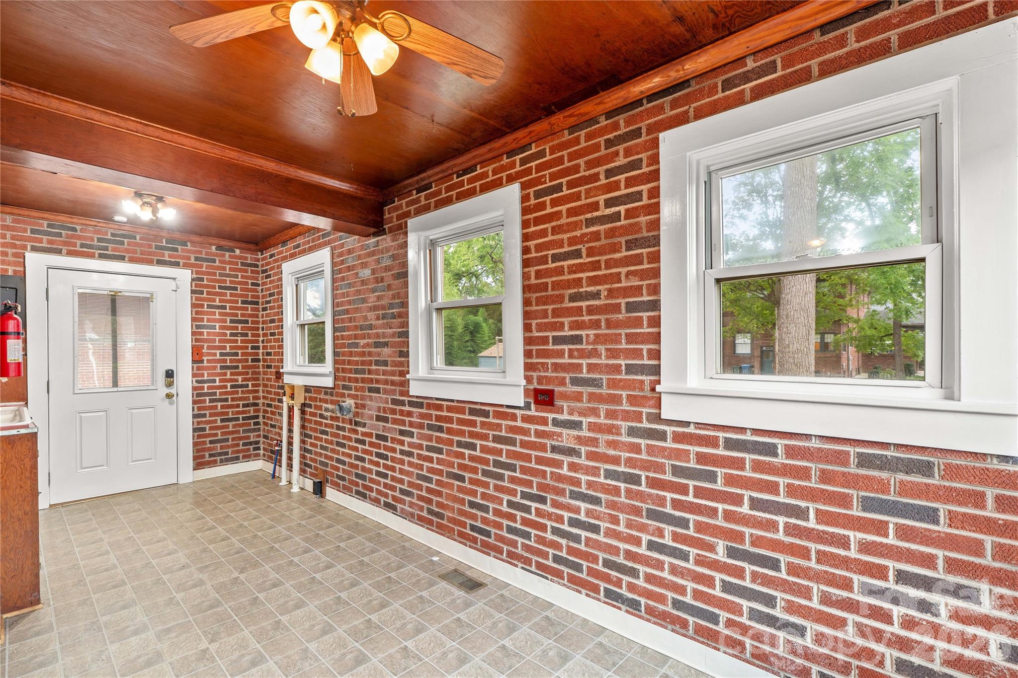 Enter from the back of the house directly into the utility/sunroom. - 615 S Church Street, Salisbury