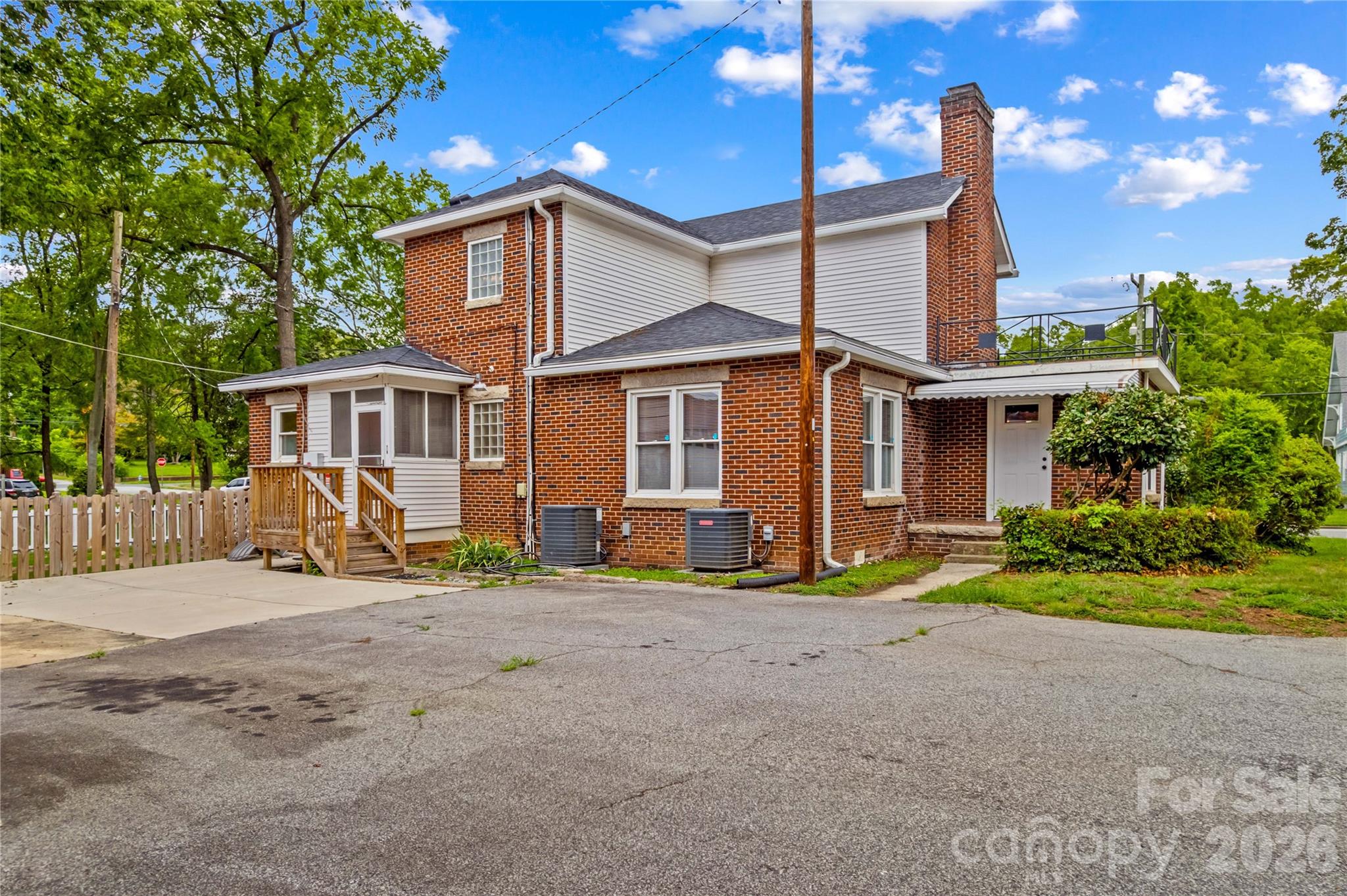Three back entrances to house, fenced side yard, parking pad. - 615 S Church Street, Salisbury