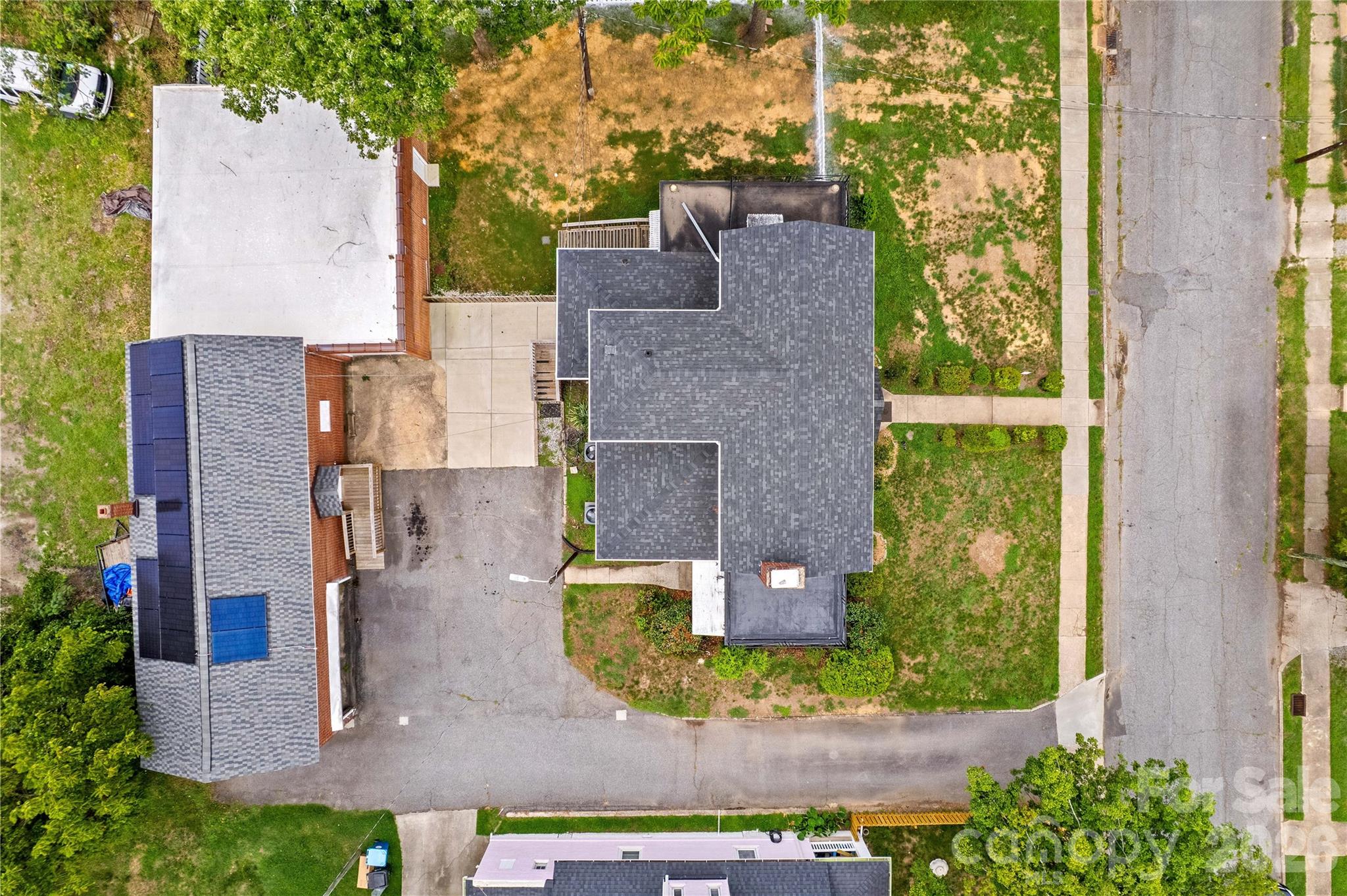 Home and buildings provide more than ample space for storage or at-home workshop. City owns the shared driveway "alley." - 615 S Church Street, Salisbury