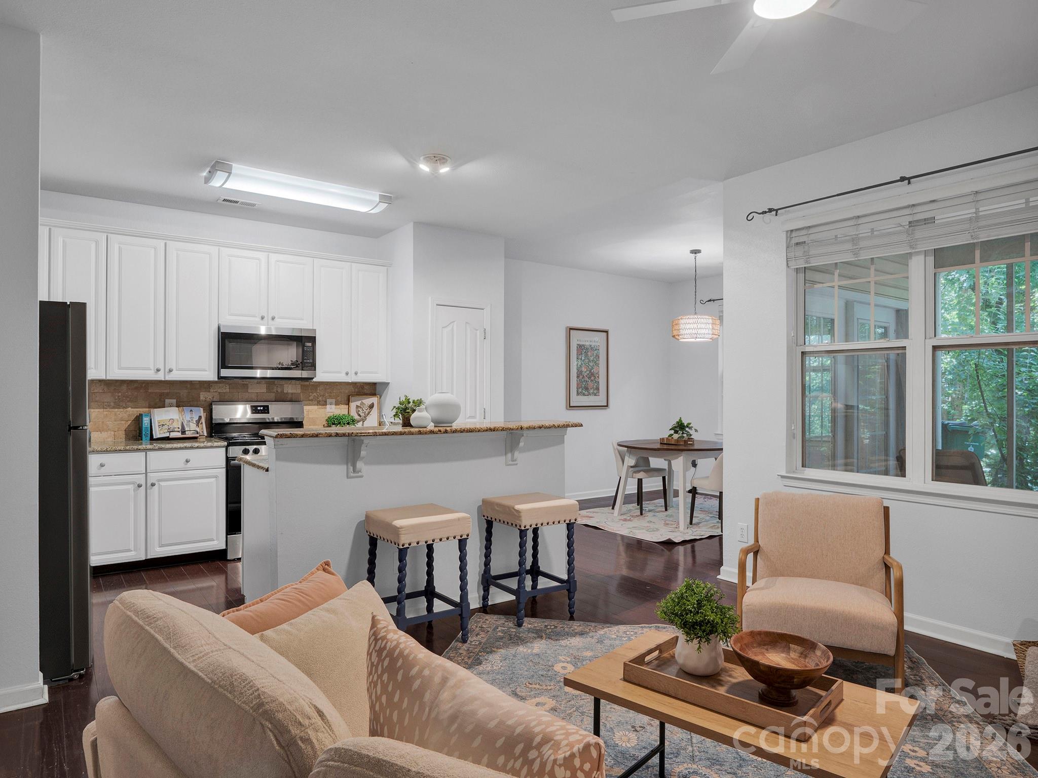 Dining area off kitchen with views to mature trees - 10747 Essex Hall Drive, Charlotte