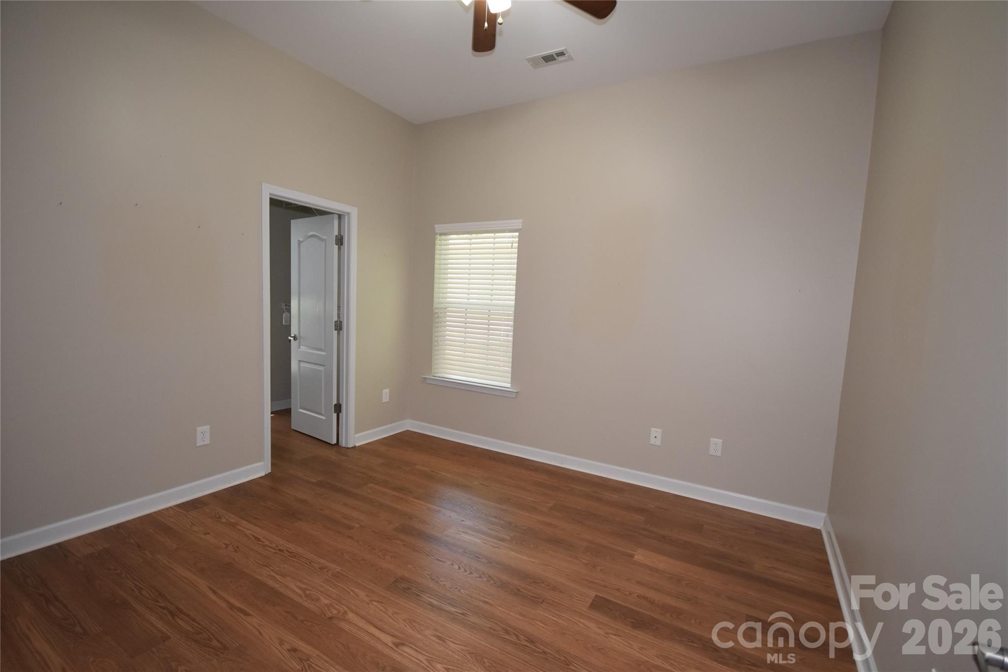 Bedroom with walk in closet with window in closet - 713 Trailhead Lane, Fort Mill