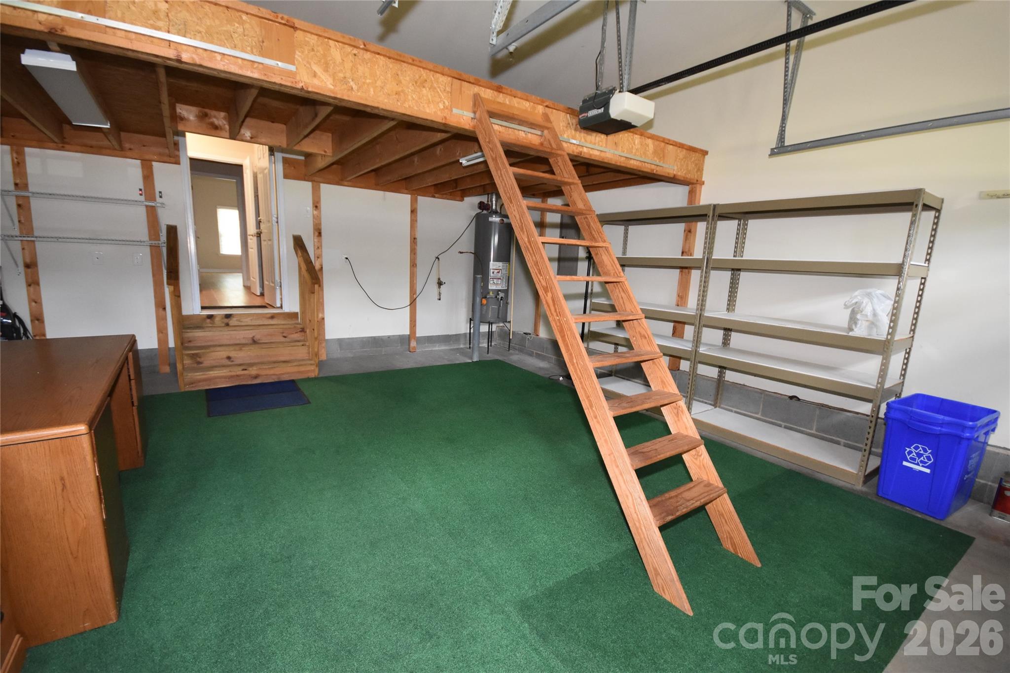 Garage with walk up additional storage (ladder can be removed) - 713 Trailhead Lane, Fort Mill