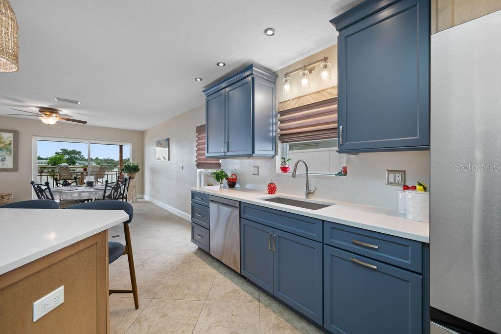 Open concept to the dining room and easy access to the outdoor deck - 530 79TH ST S, ST PETERSBURG