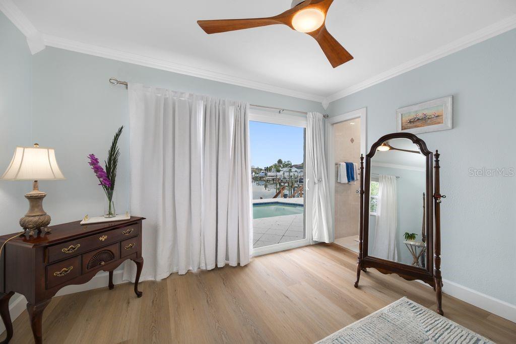 Primary Bedroom - Sliders to the Pool - Entrance to En-Suite Bathroom - 530 79TH ST S, ST PETERSBURG