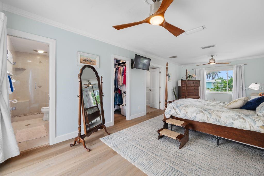 Primary Bedroom - View from Sliding Glass Door - En-Suite Bathroom - Walk-In Closet - Hallway Entrance - 530 79TH ST S, ST PETERSBURG