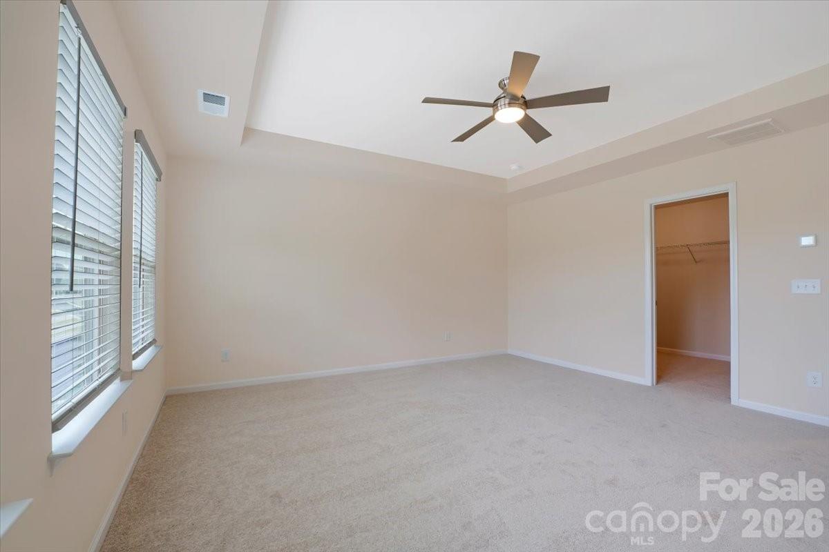 Primary suite with tray-ceiling, new carpet and walk-in closet - 15505 Davidson East Drive, Davidson