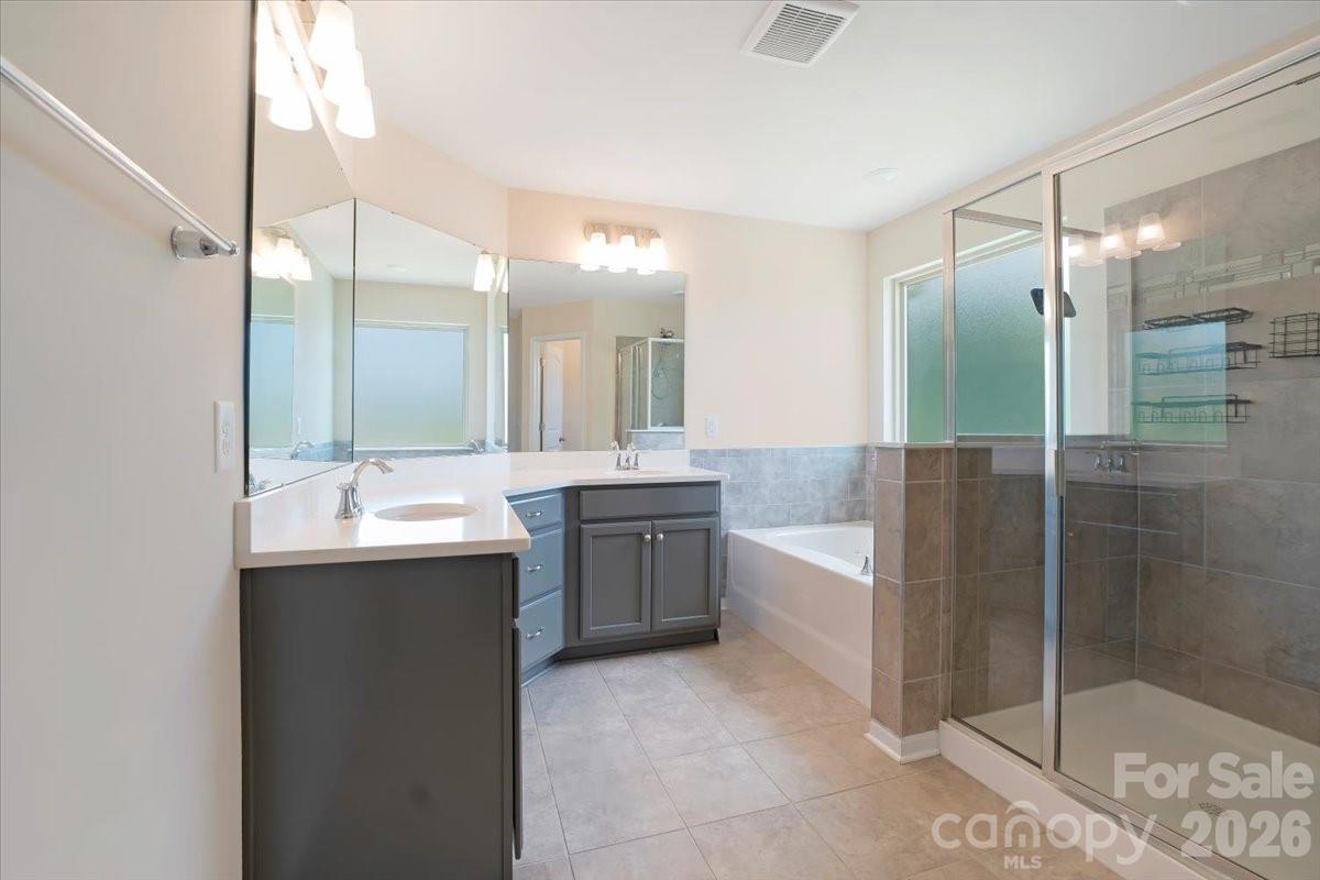 Primary bathroom with garden-tub, walk-in shower, dual vanity - 15505 Davidson East Drive, Davidson