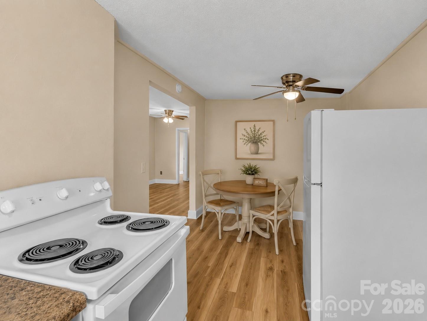 Kitchen/Breakfast Area Virtually Staged - 492 Riverbend Street, Waynesville