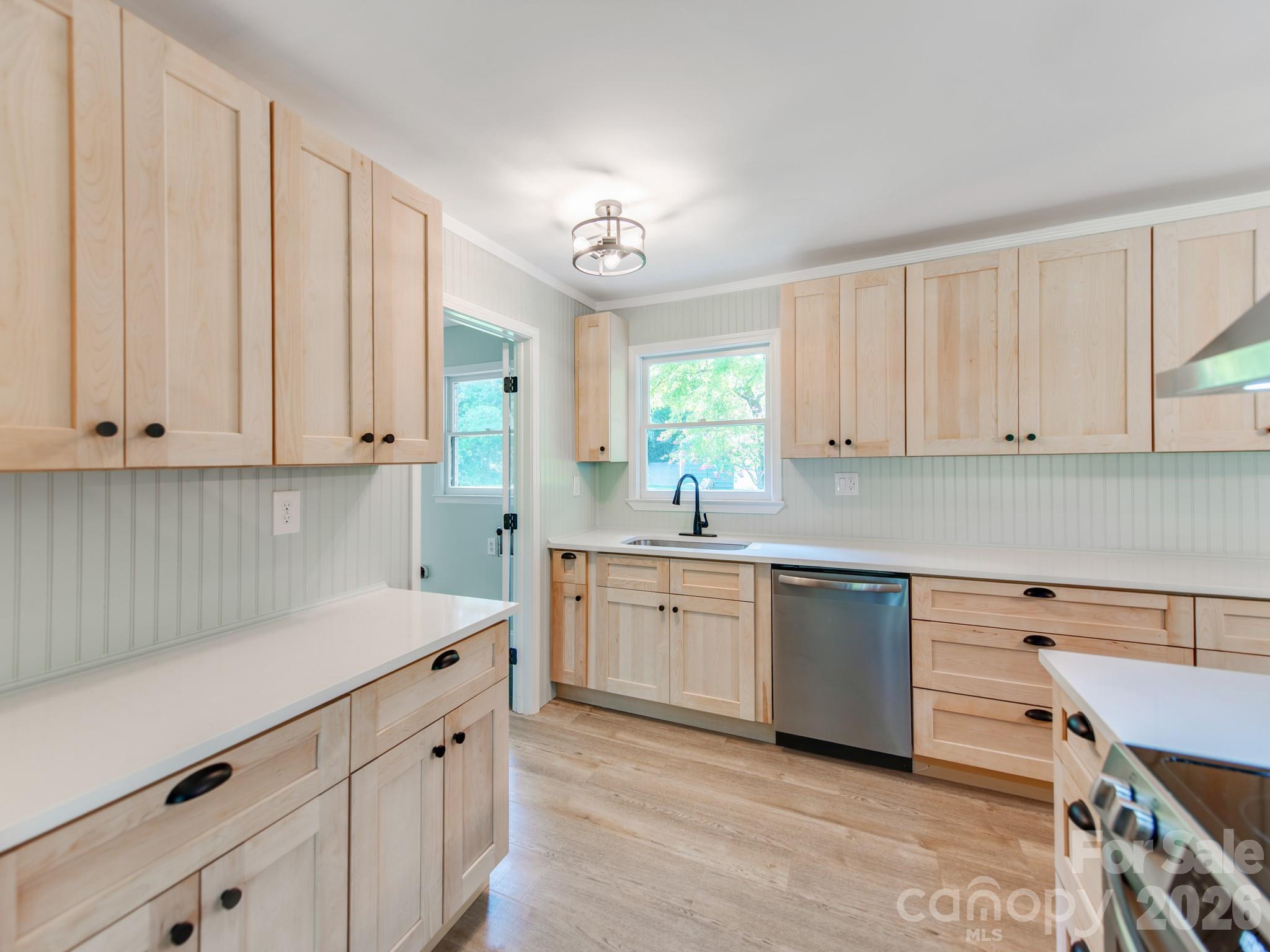 Quartz countertops compliment the new light oak cabinets - 3072 Bethany Street, Claremont