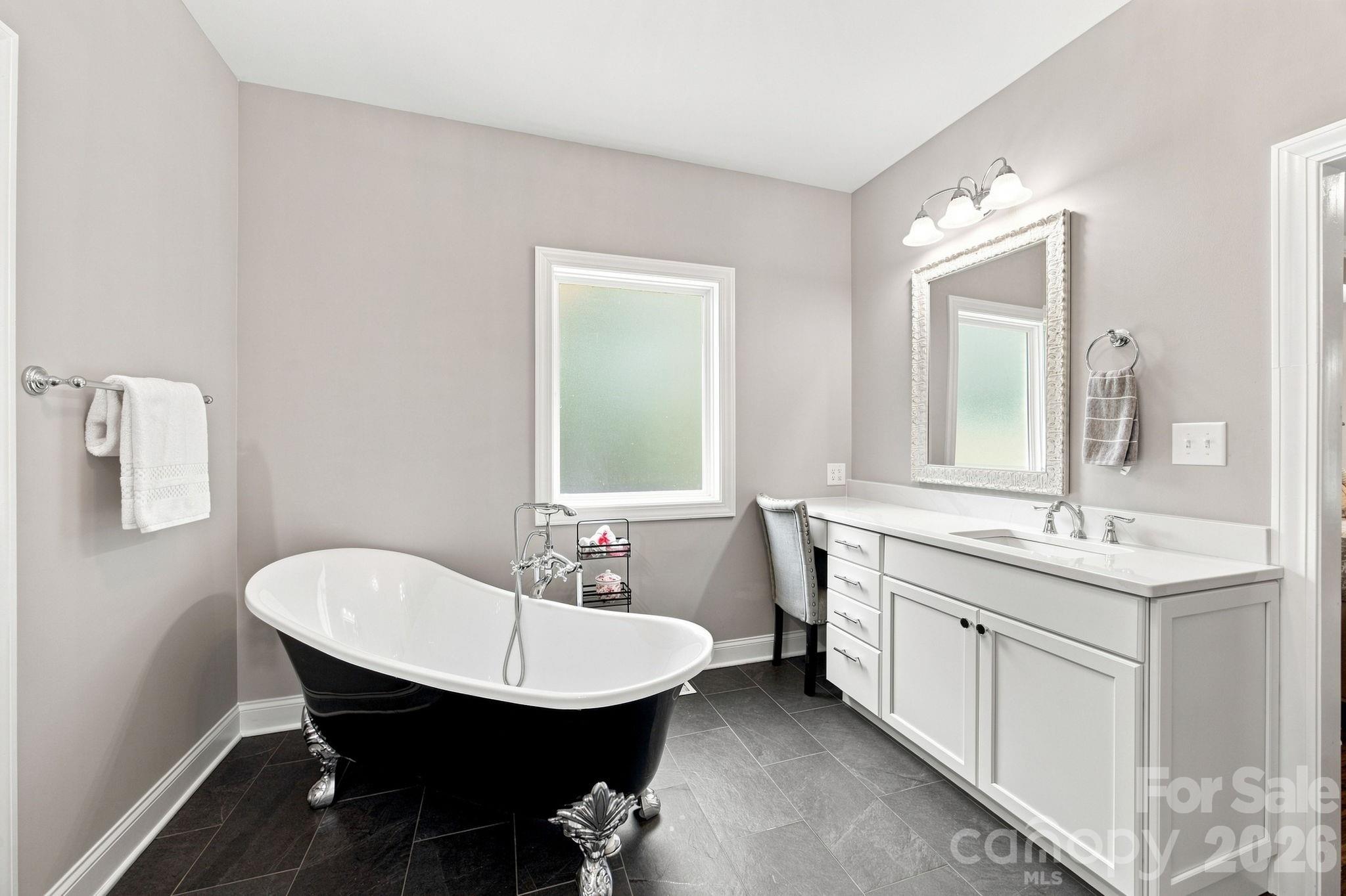 Primary ensuite bath with stunning claw foot tub. - 116 Harbor Ridge Drive, Statesville