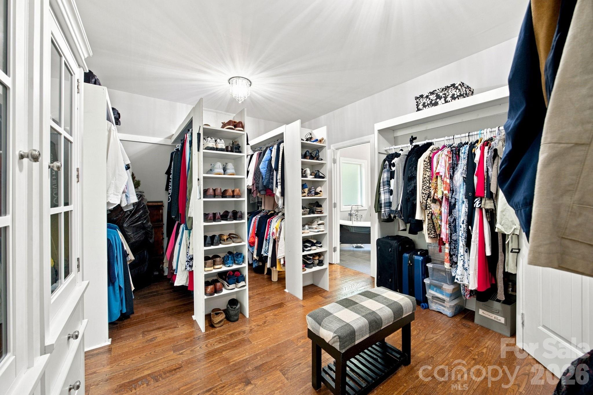 Amazing walk-in closet with custom cabinetry, built-ins, and additional closet space. - 116 Harbor Ridge Drive, Statesville