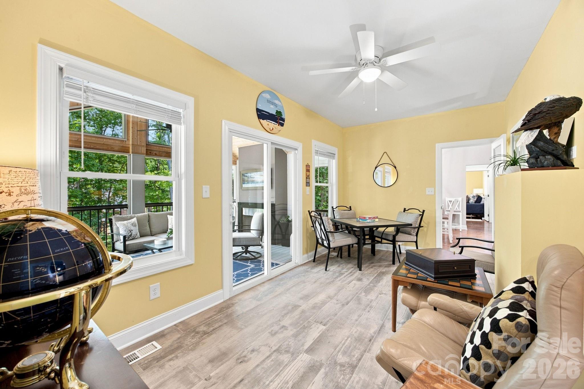Fun game room off of the screened porch is perfect for entertaining or relaxing. - 116 Harbor Ridge Drive, Statesville