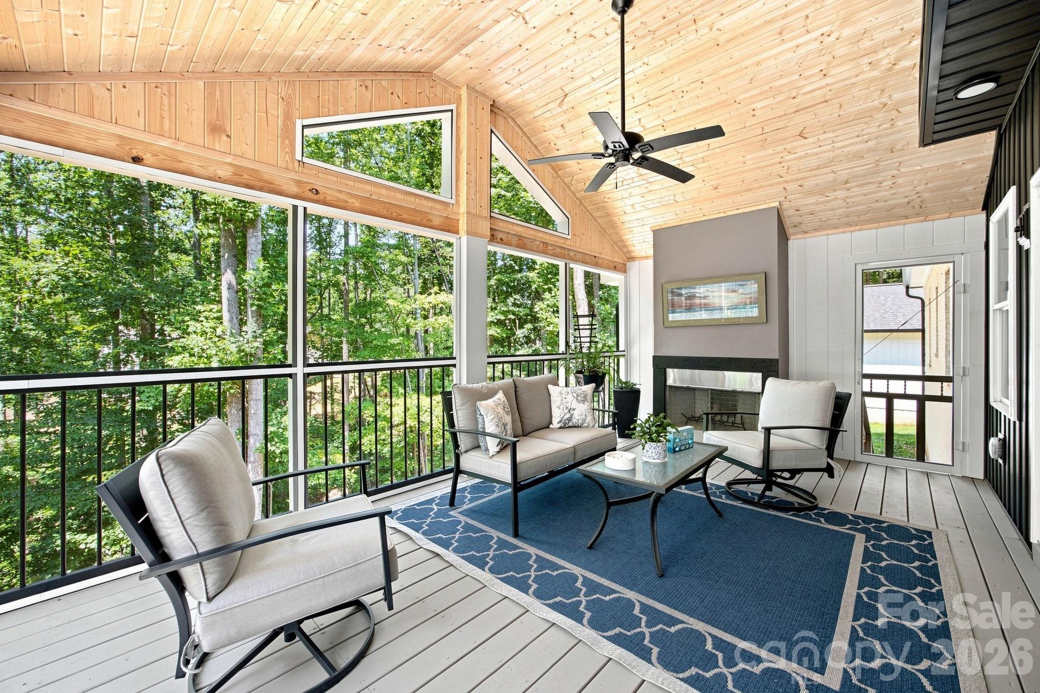 3-4 season outdoor living on the screened-in porch with wood burning fireplace. - 116 Harbor Ridge Drive, Statesville