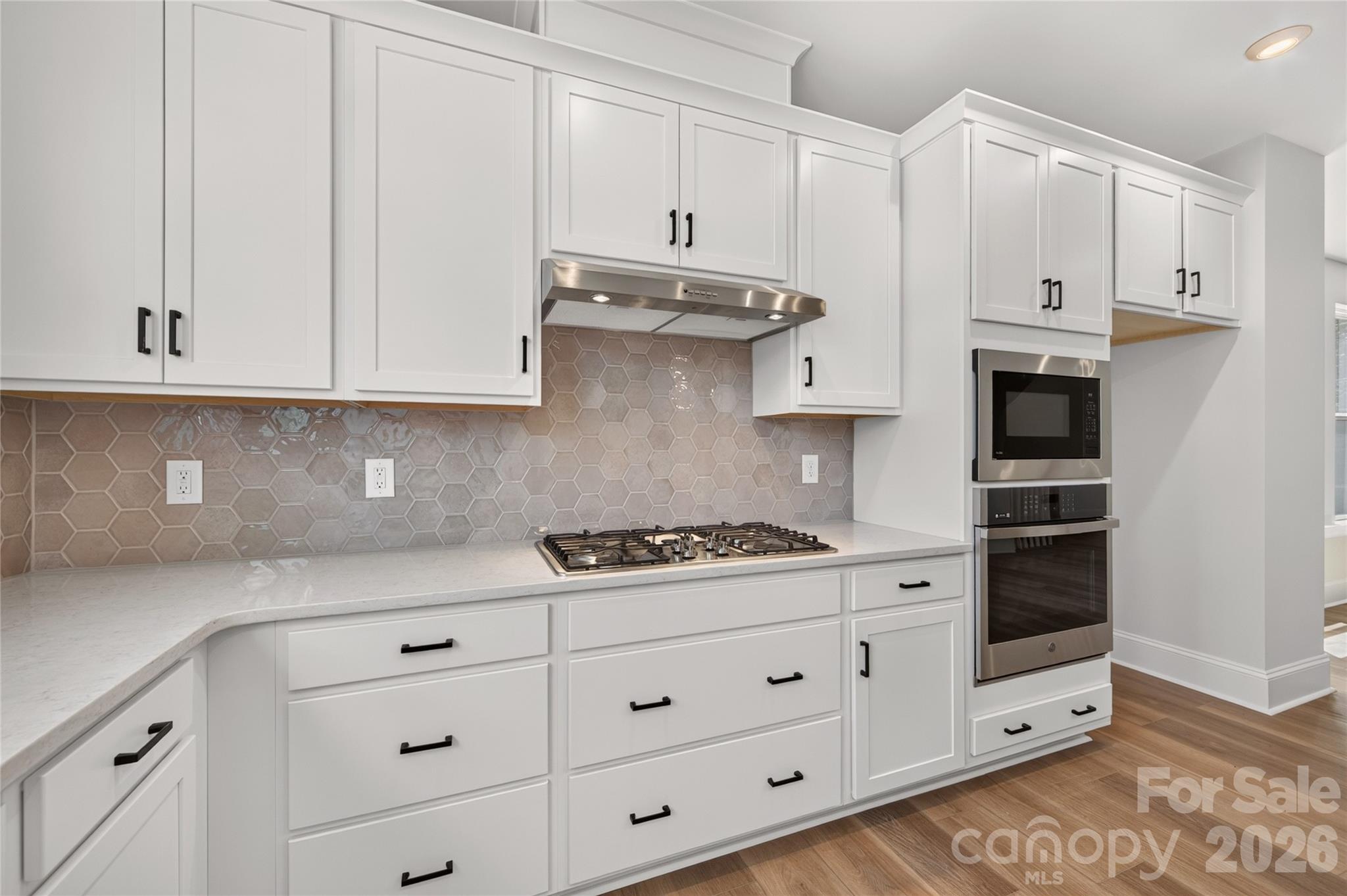 Sleek ivory backsplash - 403 Old Town Village Road, Waxhaw