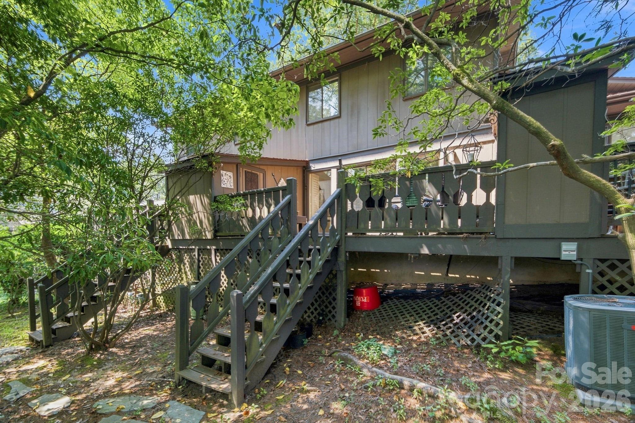 Deck stairs to ground level in back - 98 Laurelwood Circle W, Hendersonville