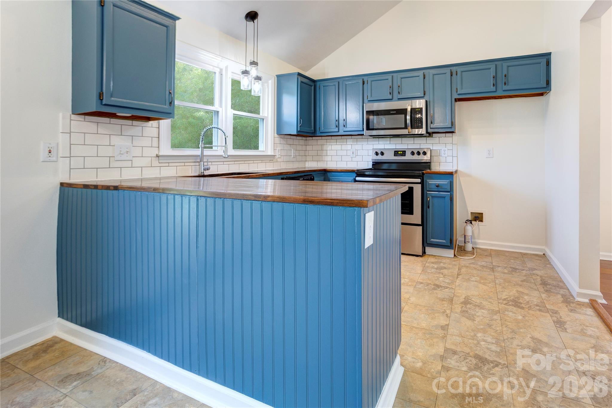 Butcher block counter tops and tile backsplash - 156 Edgewater Drive NW, Concord