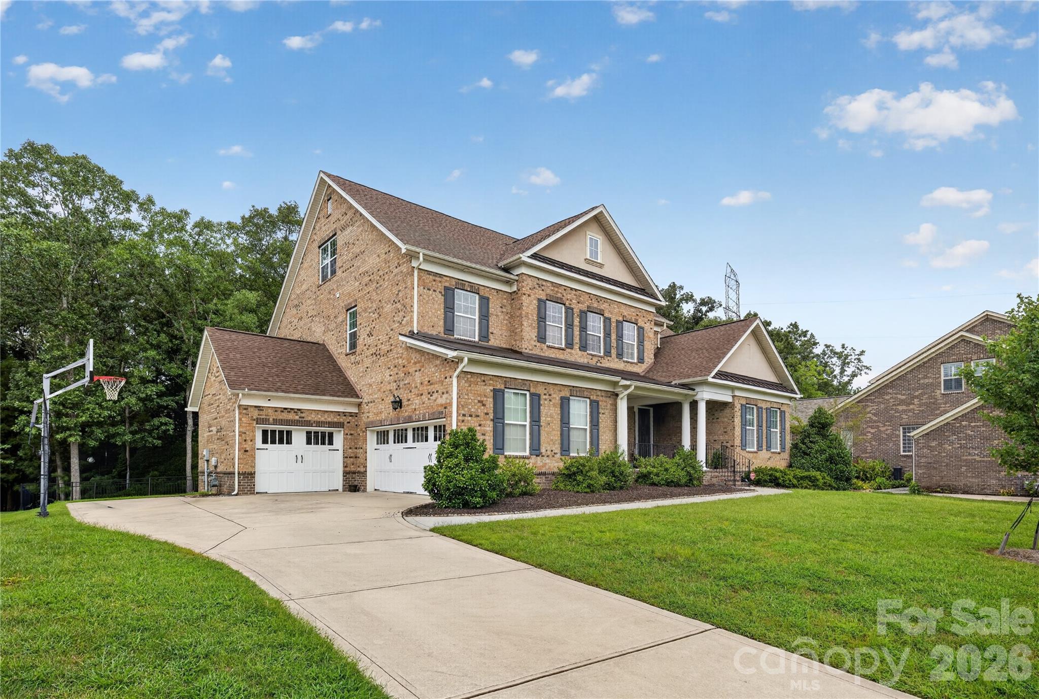 Side view with 3-car garage - 1402 Smoketree Court, Waxhaw