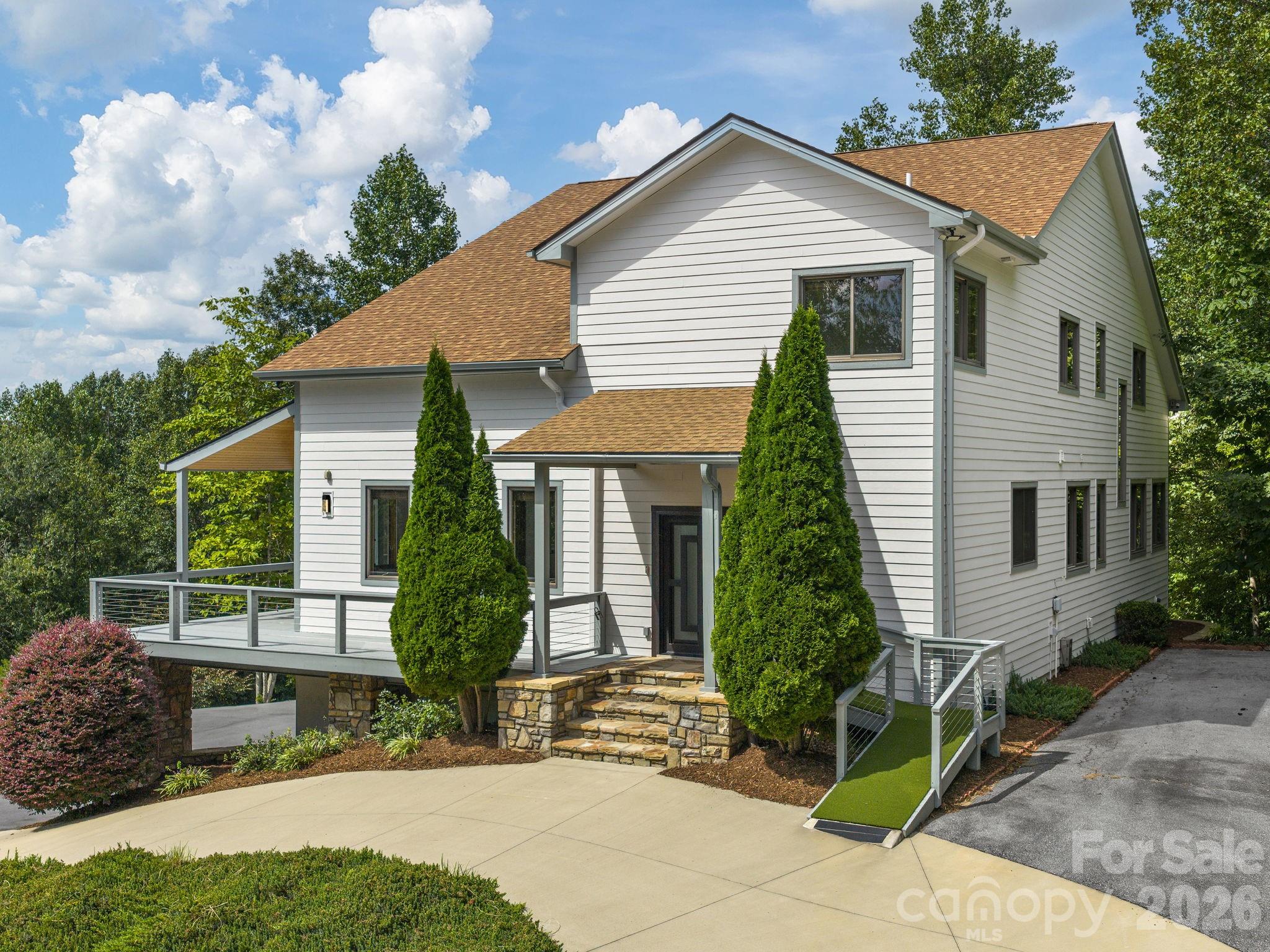Main Level Entry w/additional ramp access. Main Level parking for several vehicles. - 248 Wisdom Cove Road, Flat Rock