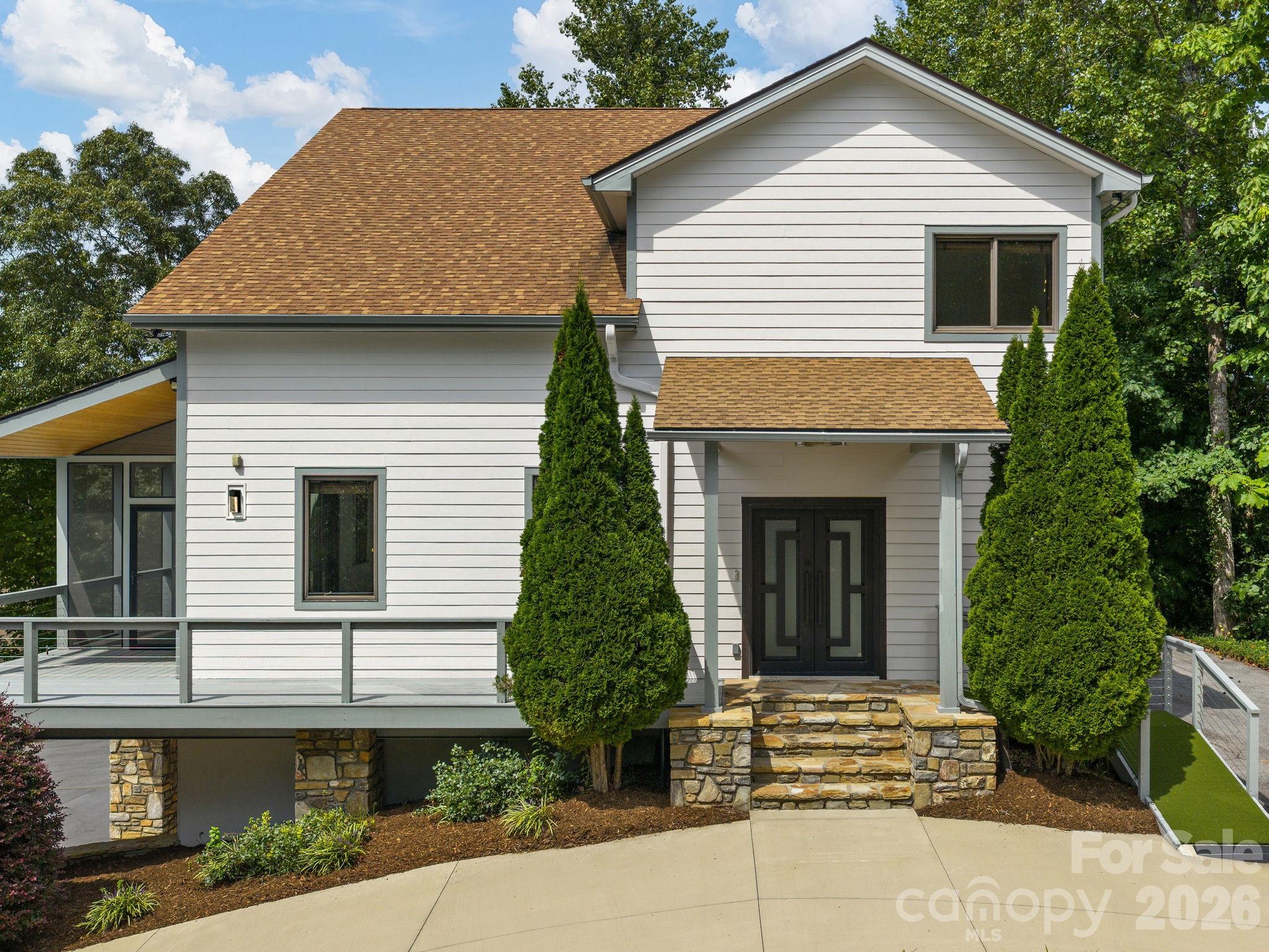 Main Level Entry. Half circle driveway. Additional driveway parking at right of front door. - 248 Wisdom Cove Road, Flat Rock