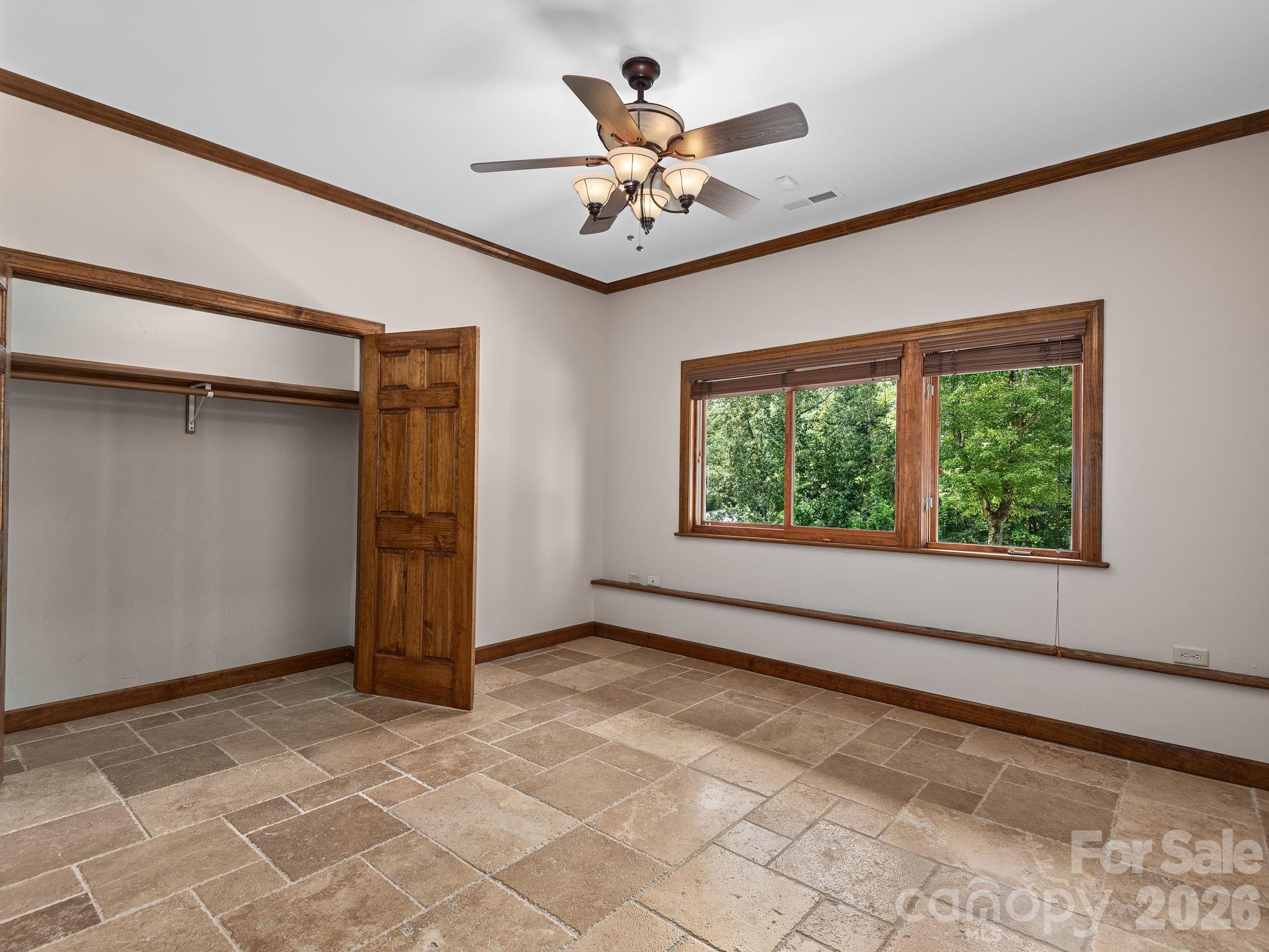 Additional sleeping room in walk out basement. This tile remains under the golf carpet throughout basement rooms. - 248 Wisdom Cove Road, Flat Rock
