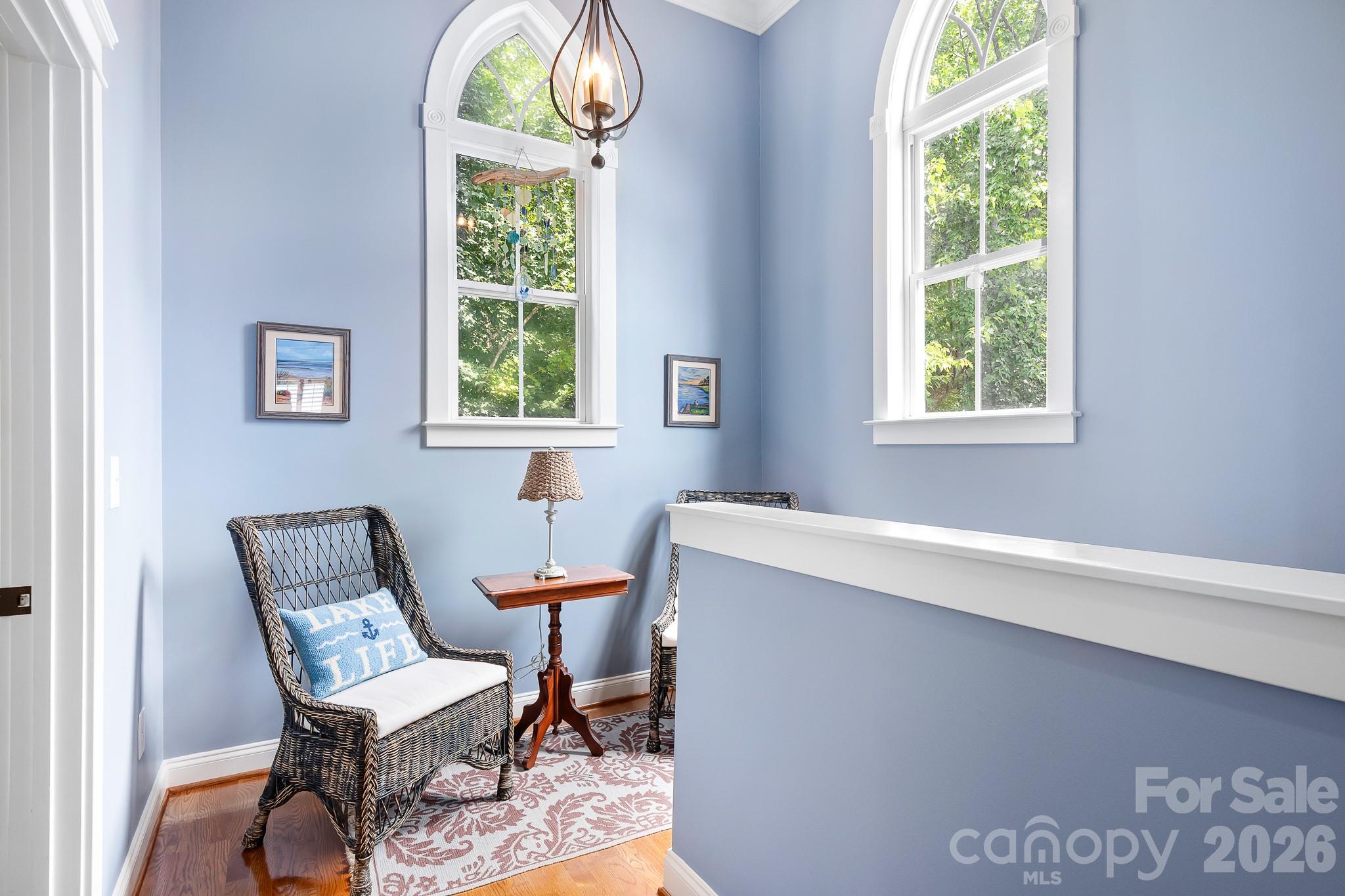 Cathedral style windows on the upstairs landing add to the charm of this home. - 17525 Calverton Road, Huntersville