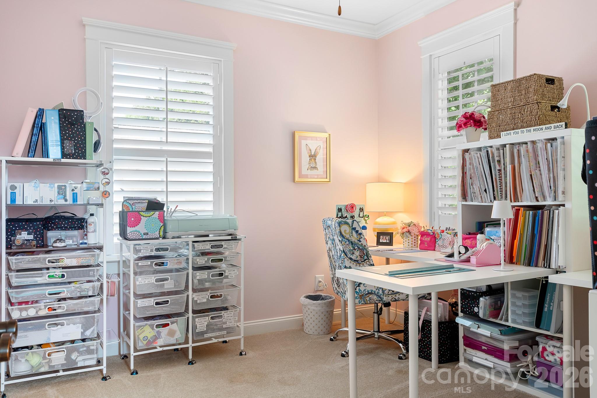 Secondary bedroom #1 is currently used as a craft room but holds a queen size bed. - 17525 Calverton Road, Huntersville