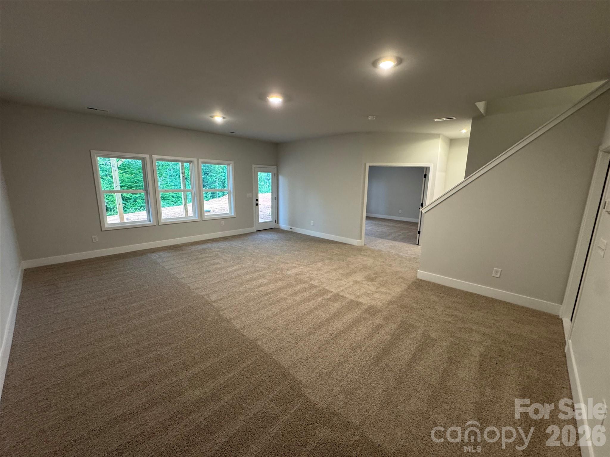 Basement Rec Room with Exterior Door to a 14x10 Patio - 133 Kerr Walk Drive, Statesville