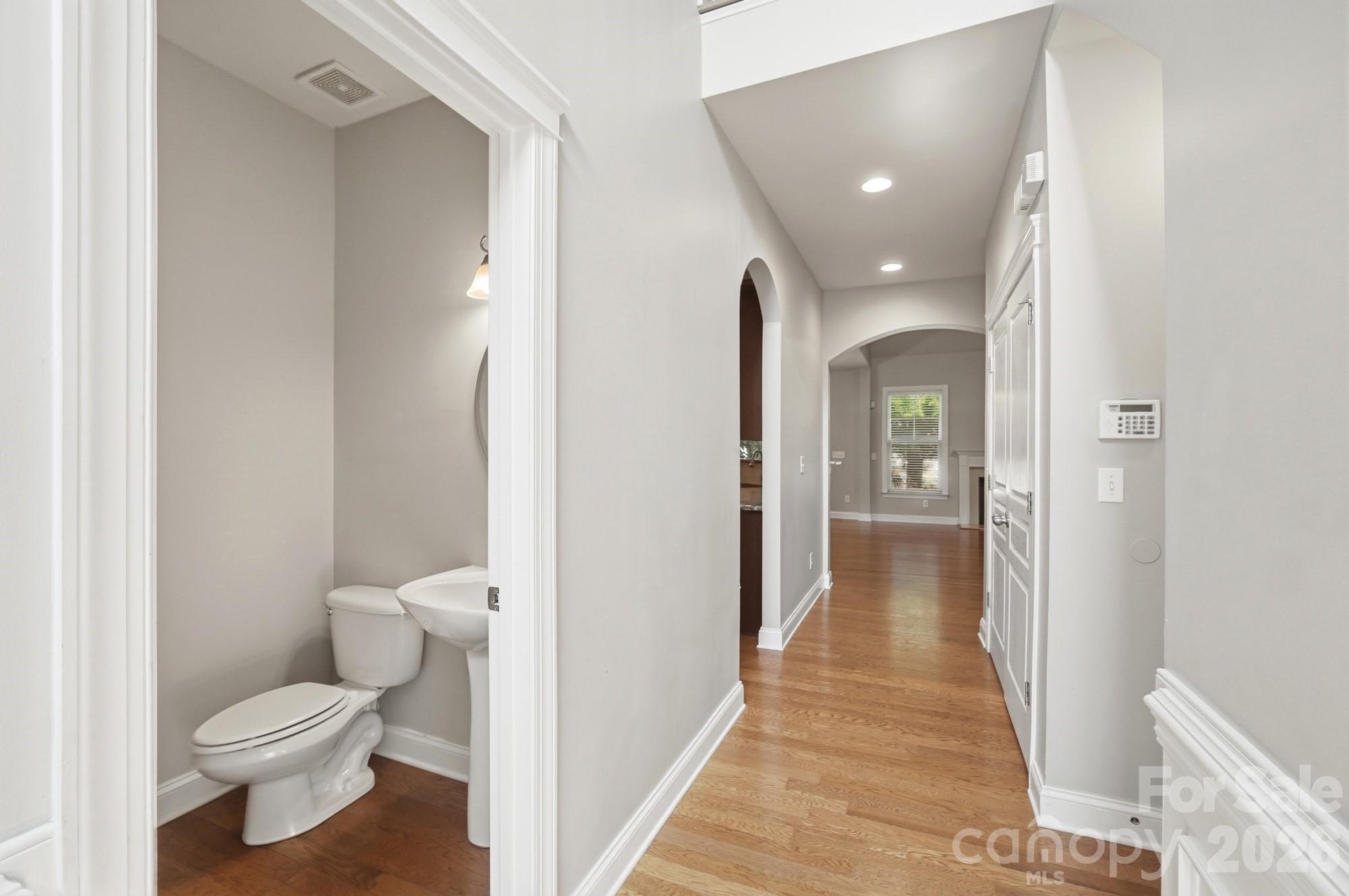 Entry to great room with half bath on left - 3016 Connells Point Avenue, Waxhaw