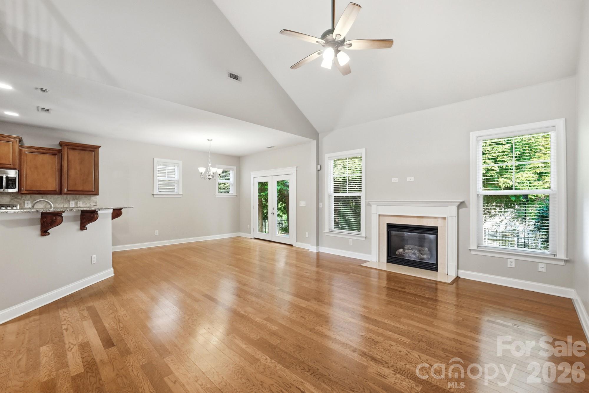 Great room opens into kitchen and breakfast area - 3016 Connells Point Avenue, Waxhaw