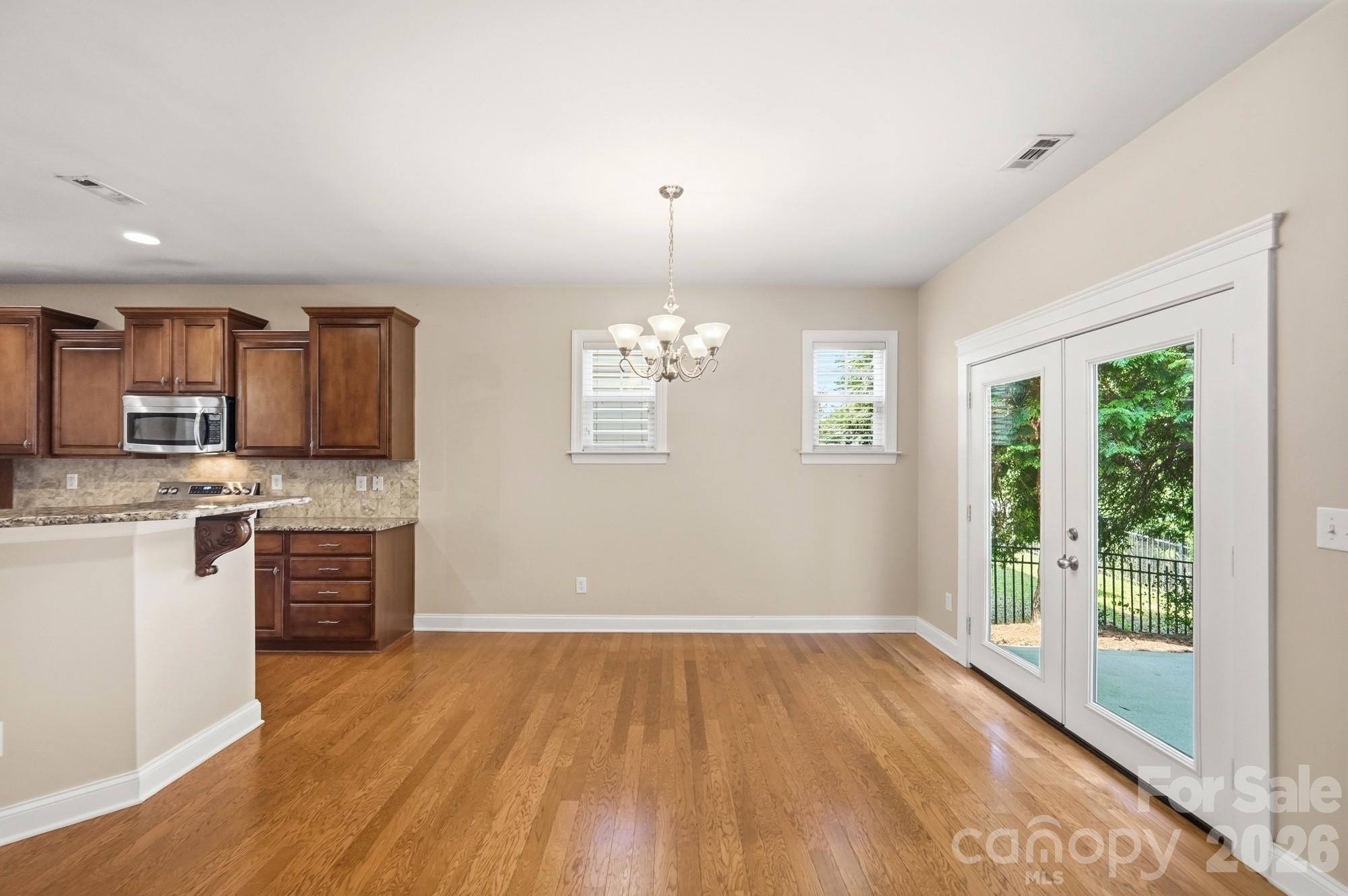 Doors open to patio from the breakfast area - 3016 Connells Point Avenue, Waxhaw