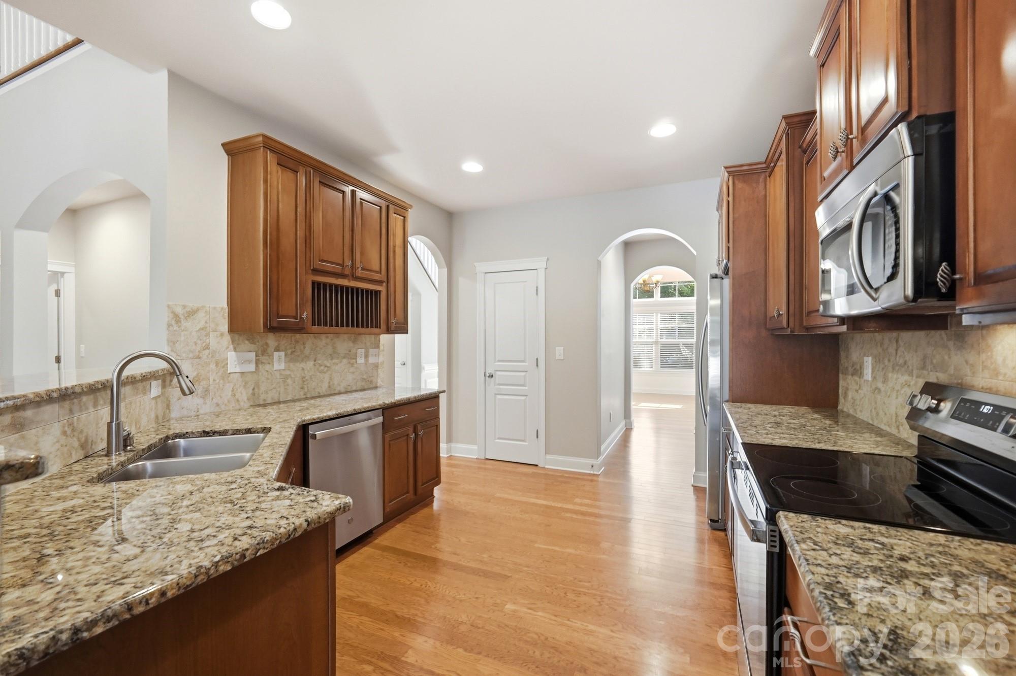 Chef's kitchen with newer stainless appliances - 3016 Connells Point Avenue, Waxhaw