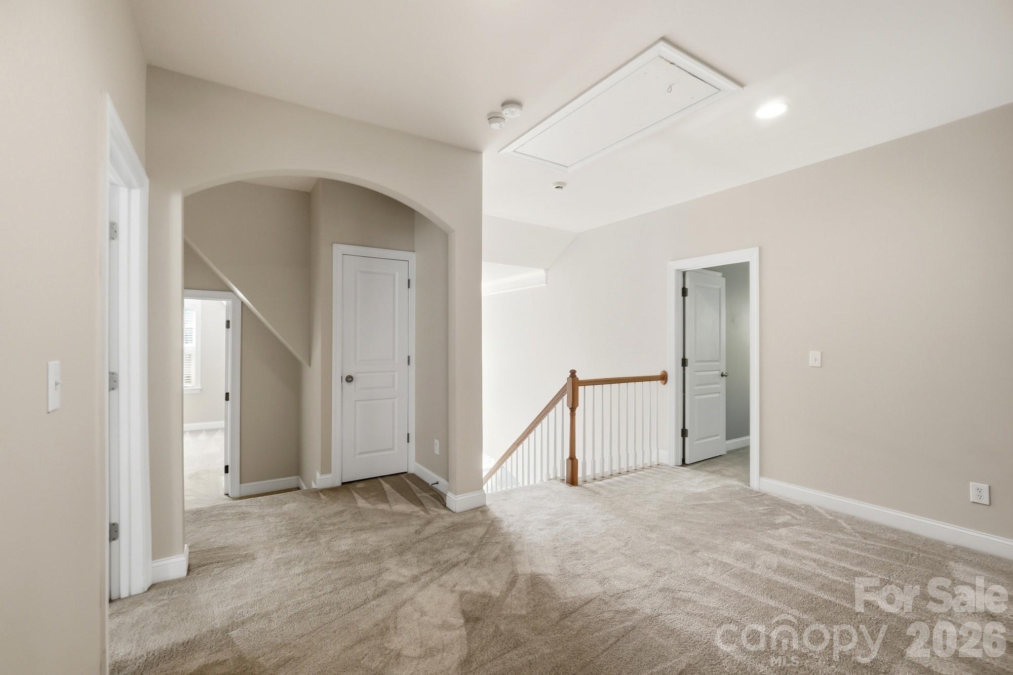 Arched door way leads to 2 bedrooms, full bath the other doorway leads to another bedroom with ensuite bathroom - 3016 Connells Point Avenue, Waxhaw