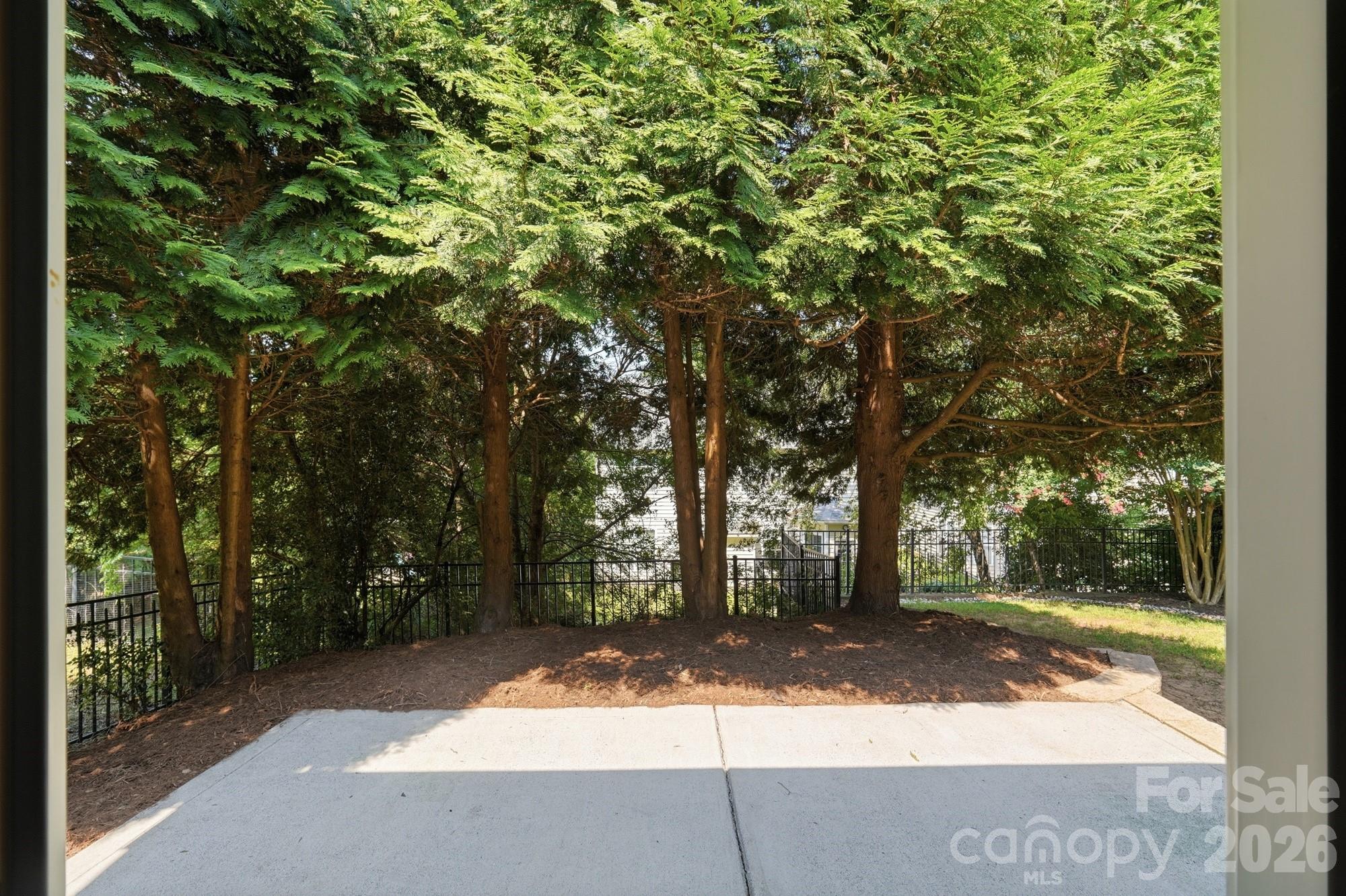 Rear patio with mature landscaping for privacy - 3016 Connells Point Avenue, Waxhaw