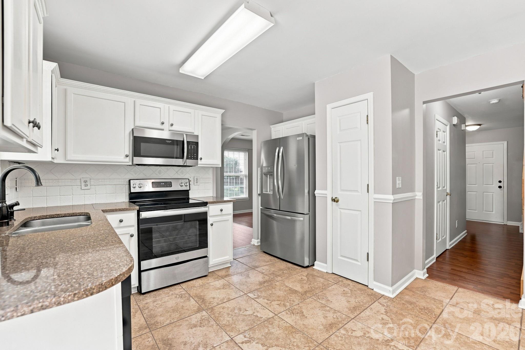 Kitchen with Tile Backsplash - 1406 Juniper Hills Lane, Indian Land