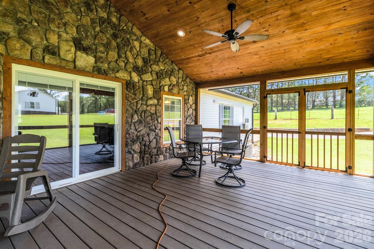 Screen room showing great wood ceilings and the stone wall - 393 Cedar Grove Church Road, Vale