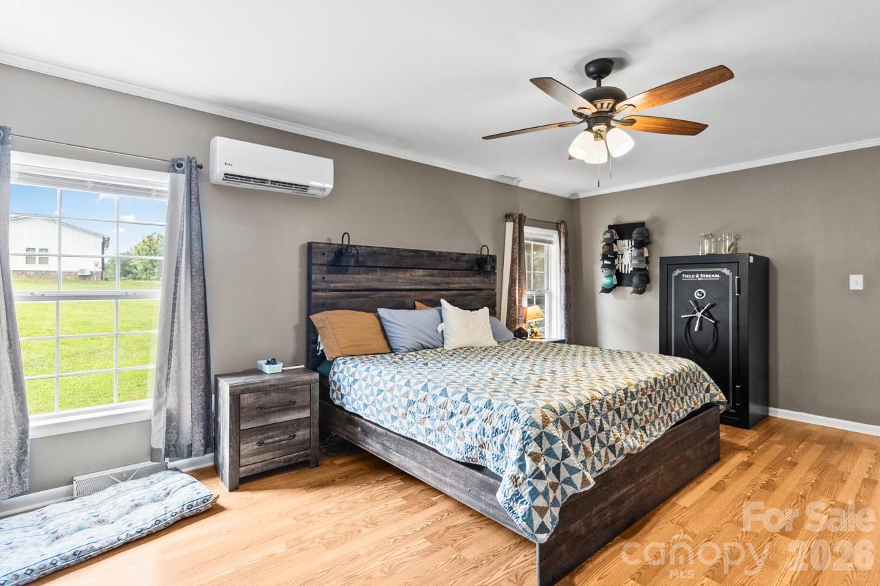 Primary bedroom. Notice the mini split - get the temp down to 61 - 393 Cedar Grove Church Road, Vale