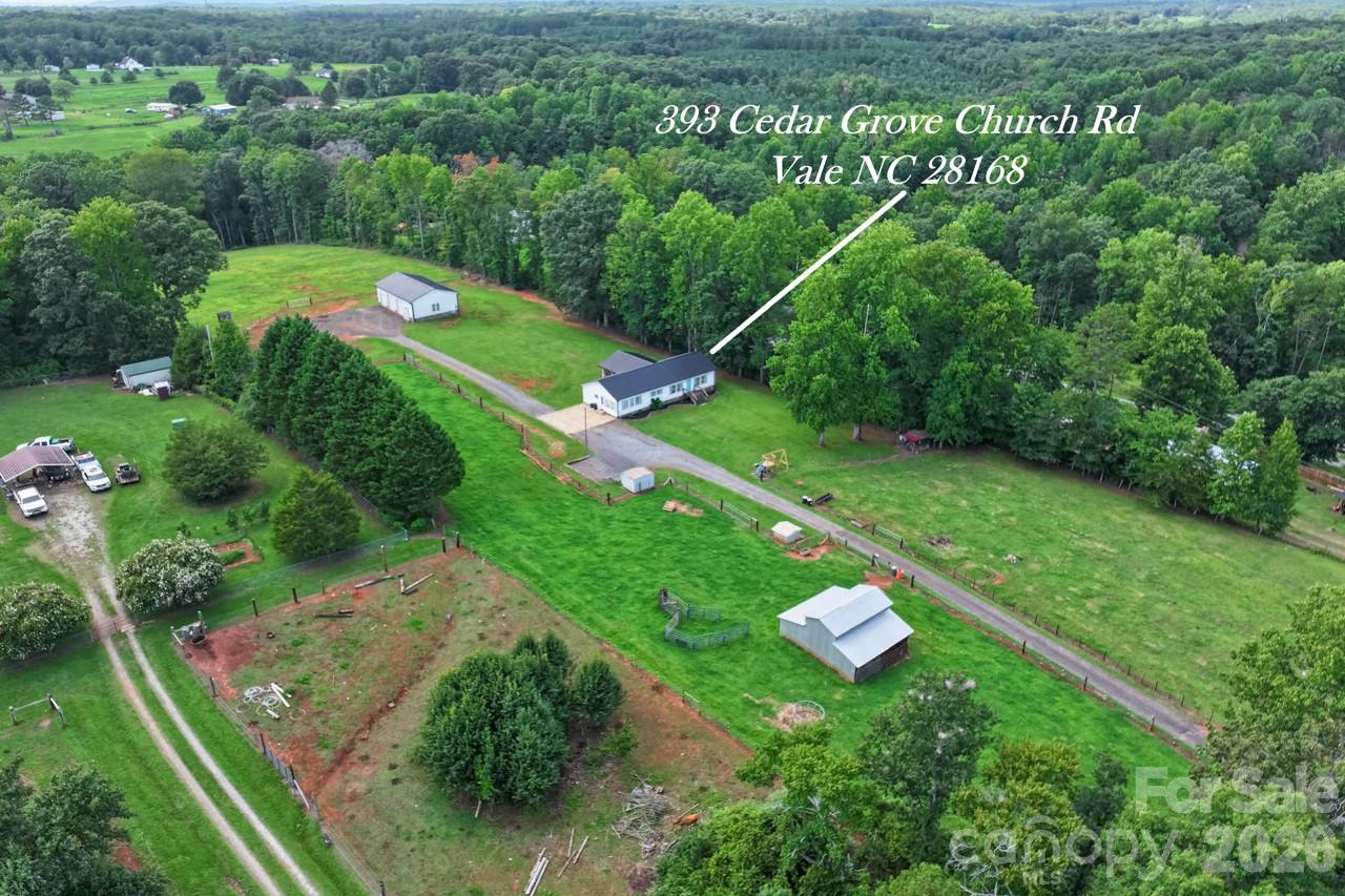 Drone view of property. Home / shop / barn / 3 pastures - 393 Cedar Grove Church Road, Vale
