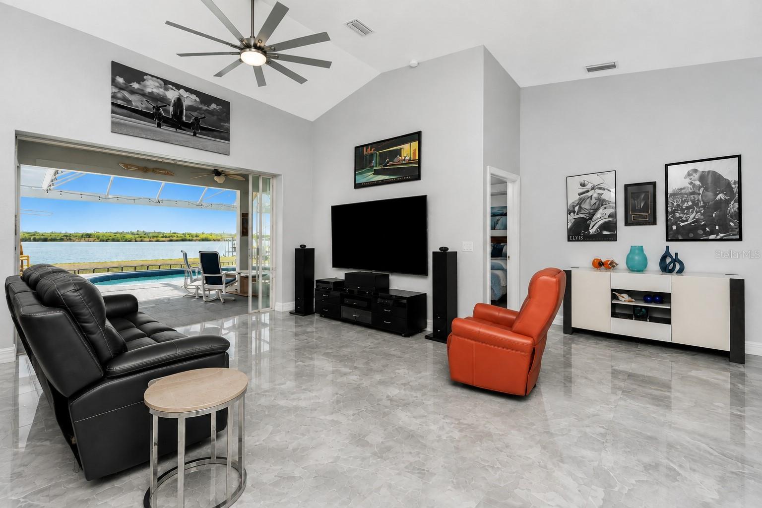 Modern and bright open concept family room with vaulted ceilings. - 16168 LA BARGE CIR, PORT CHARLOTTE