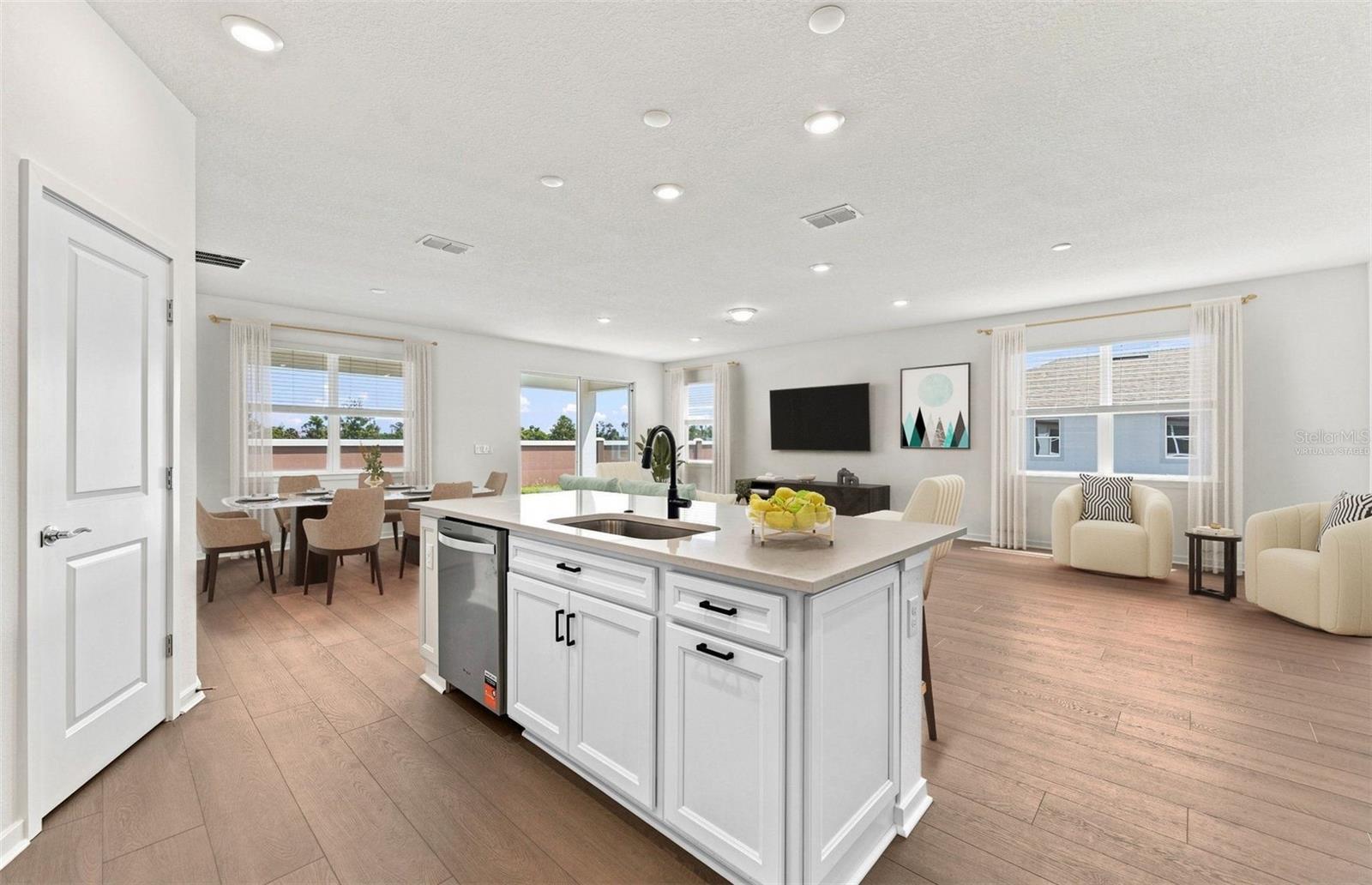 Virtually Staged - Open Kitchen to Cafe to Gathering Room - 9928 JOHNSON OAKS GLN, PARRISH