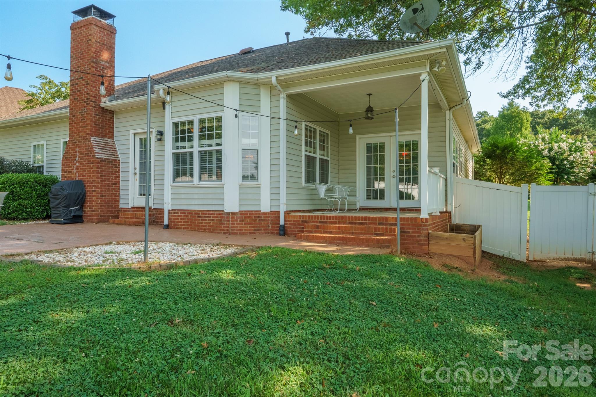 Covered patio off of kitchen - 12524 Willow Grove Way, Huntersville