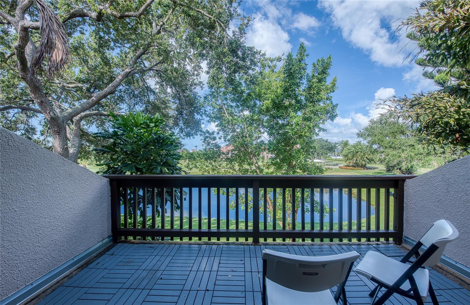 Balcony with golf course and pond view - 1328 PELICAN CREEK XING #D, ST PETERSBURG