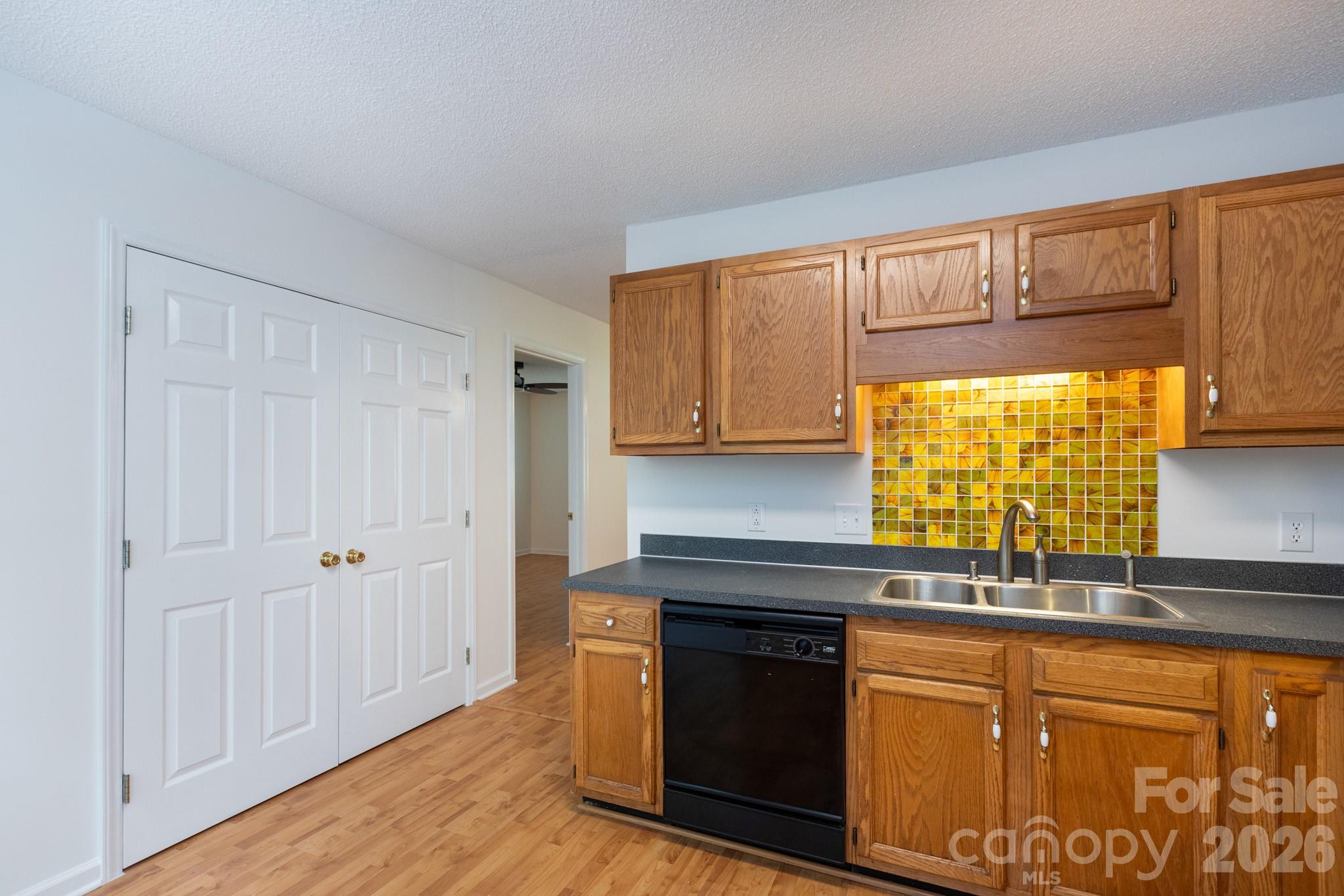 Kitchen with large laundry closet - 820 SE Clearview Court SE, Concord